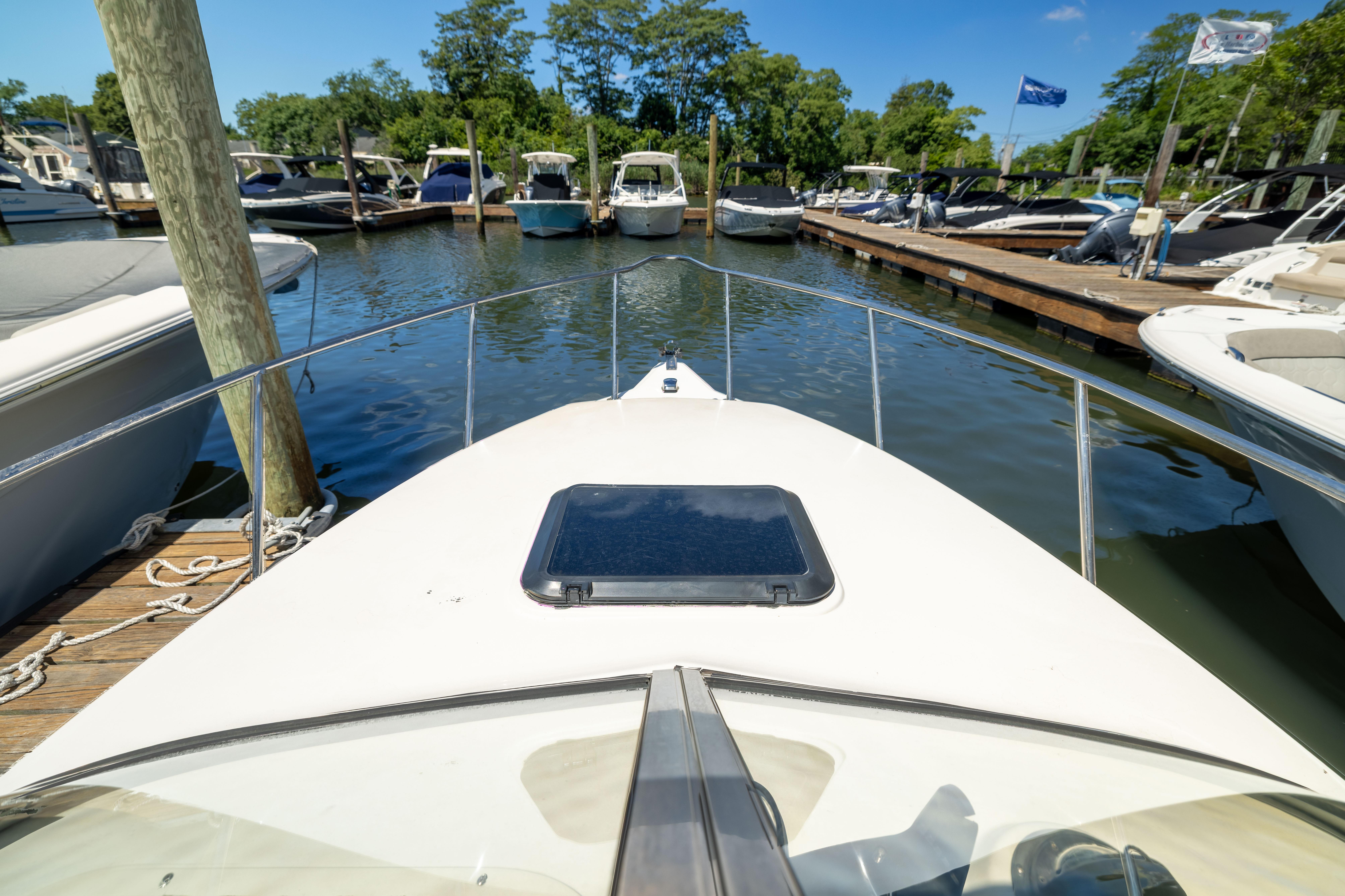 Bow view of a 2012 KEYWEST 2020 WA boat docked at a marina.