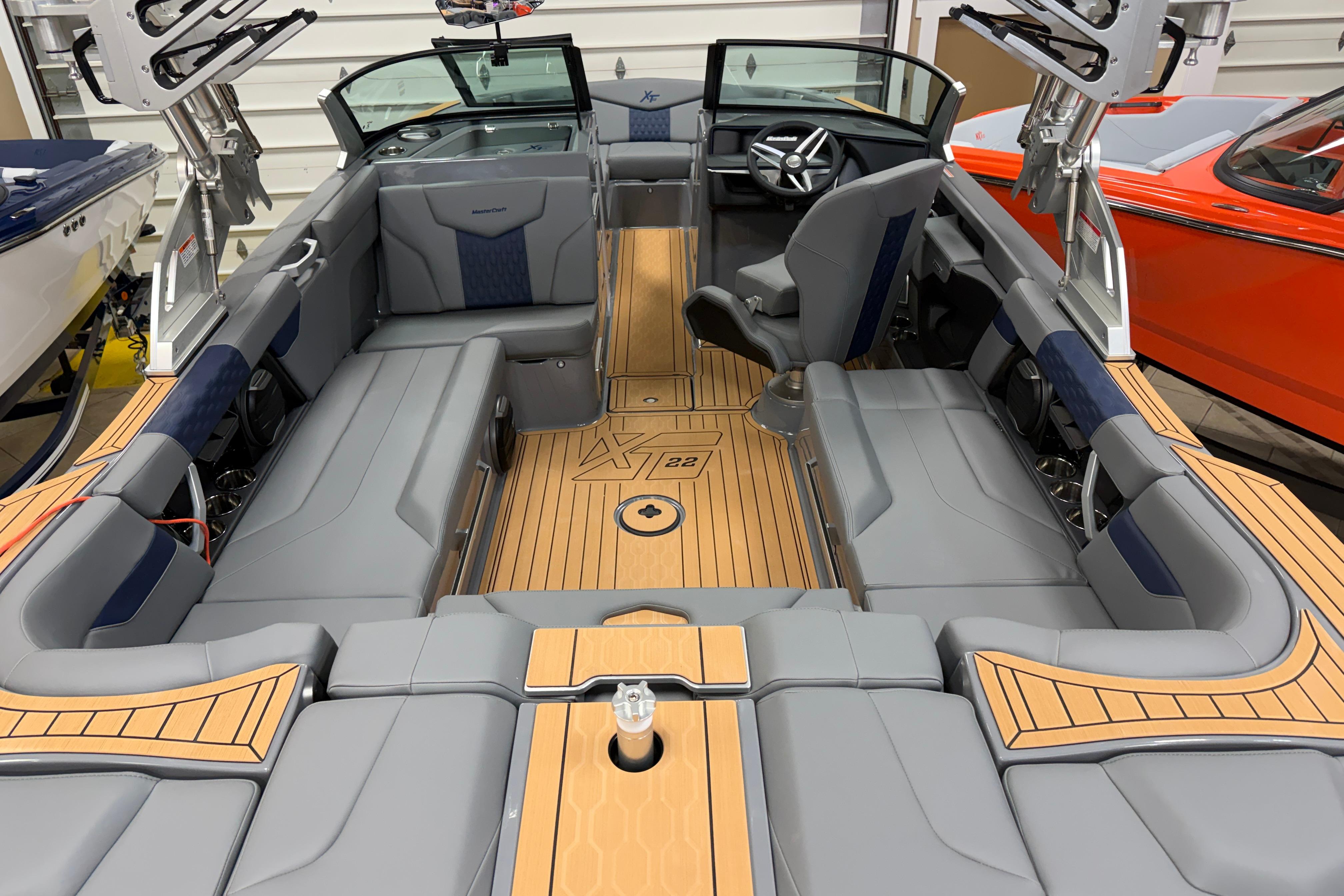 2026 MasterCraft XT22 boat interior with sleek gray seating and modern design.
