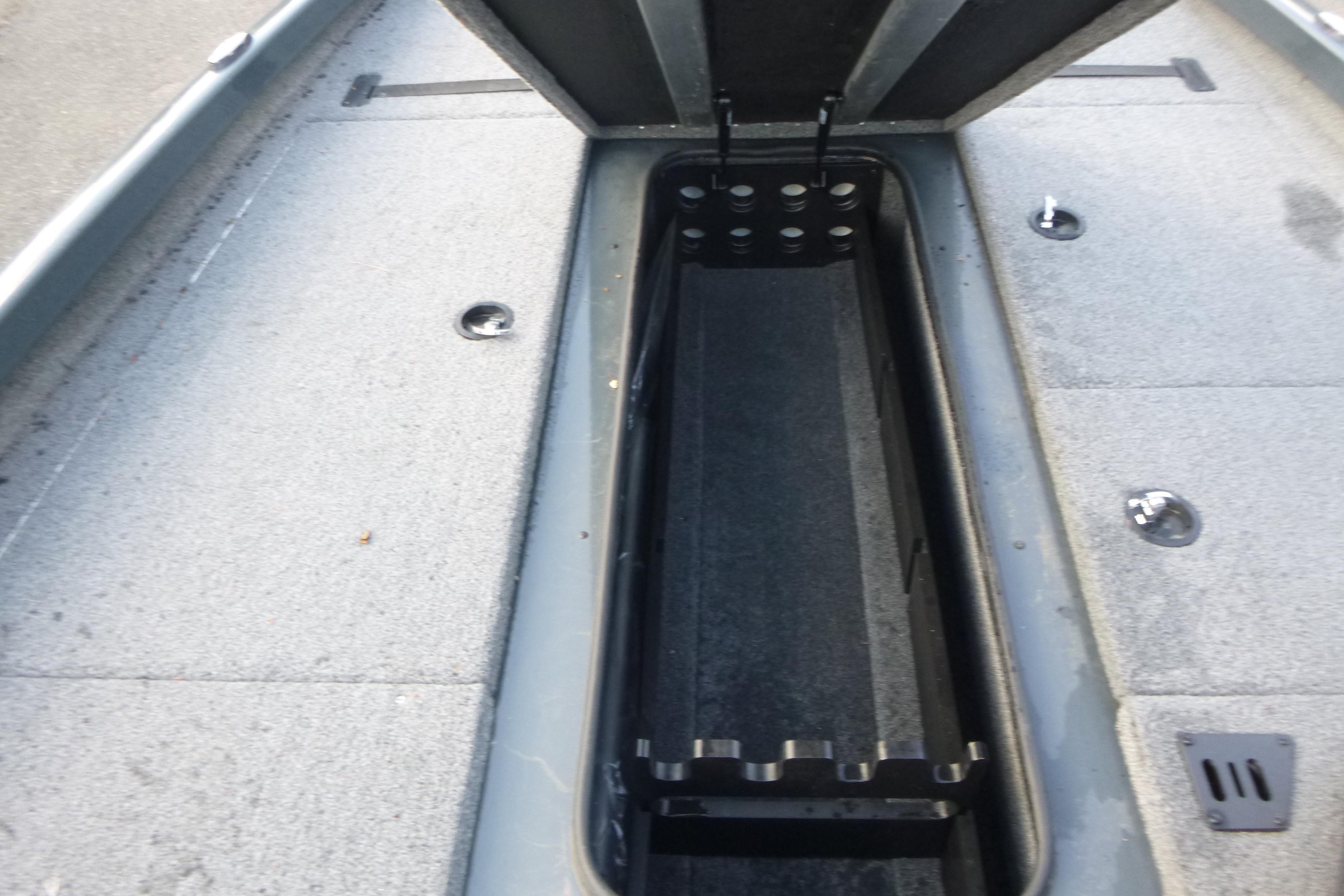 2023 Ranger RT198P boat interior storage compartment with open lid, showcasing spacious design.