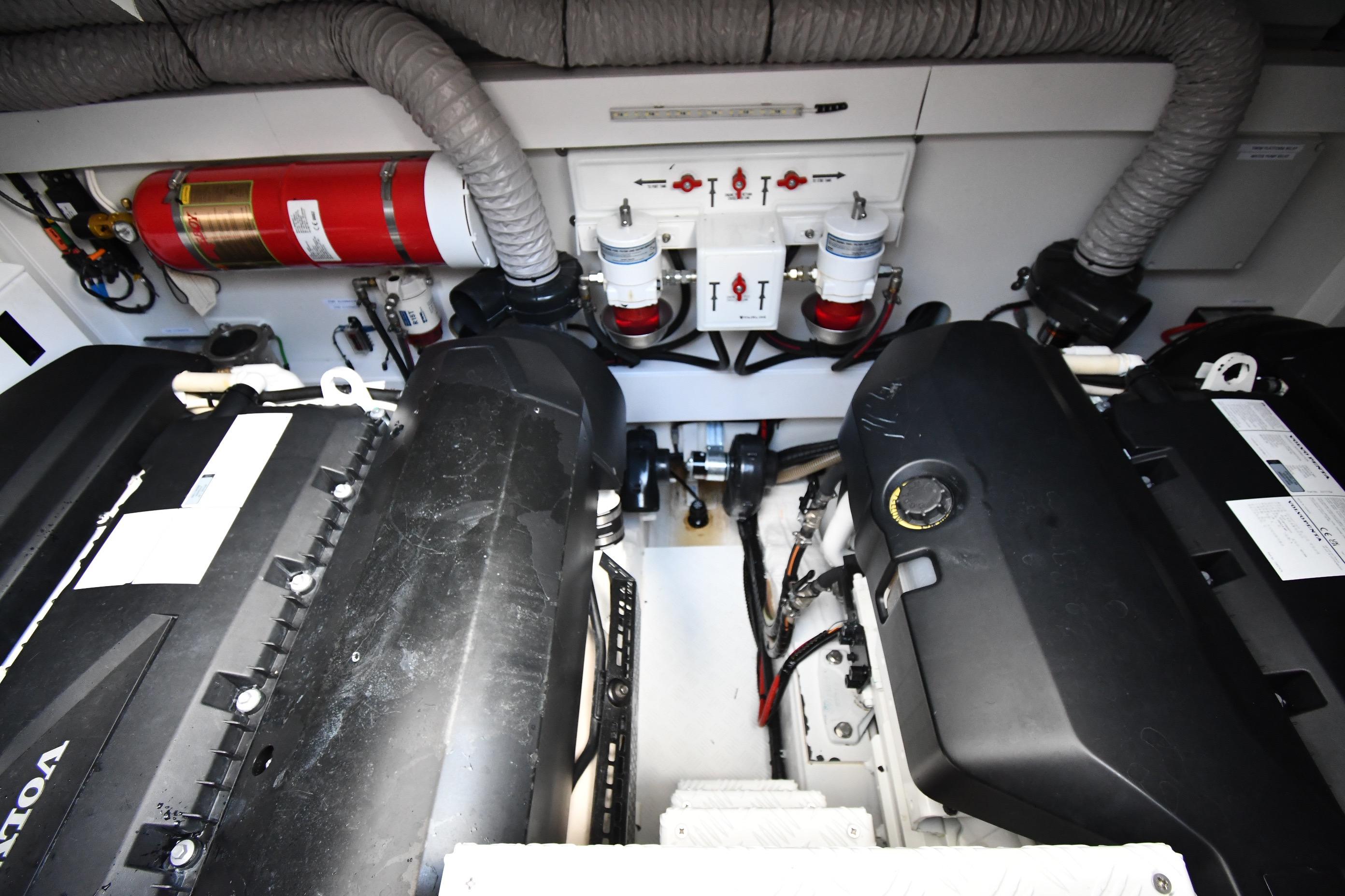 Engine room of 2024 Fairline G50 Targa yacht, featuring Volvo engines and safety equipment.