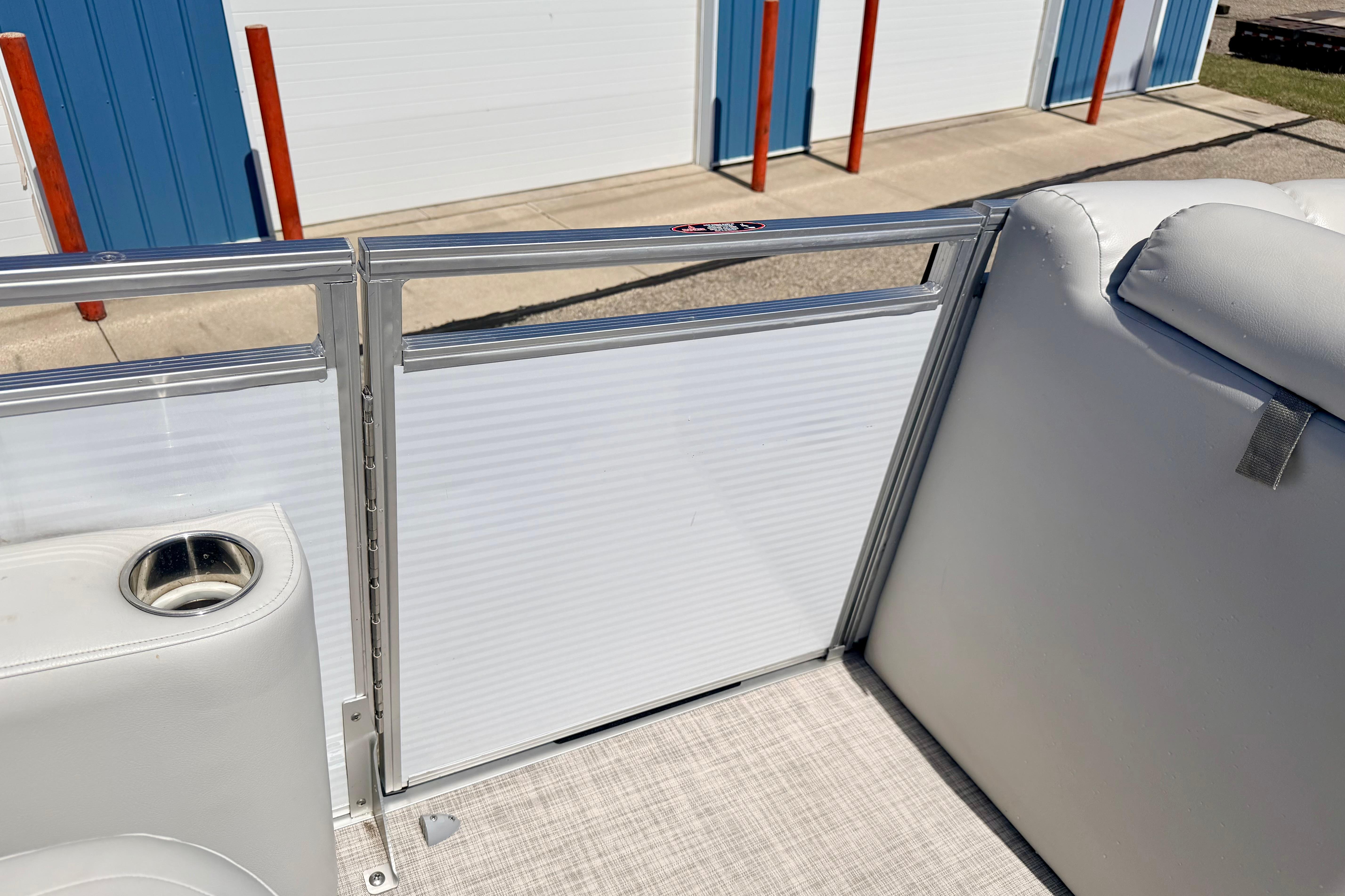 2019 Crestliner 240 Rally DX CW boat interior with white seating and cup holder.