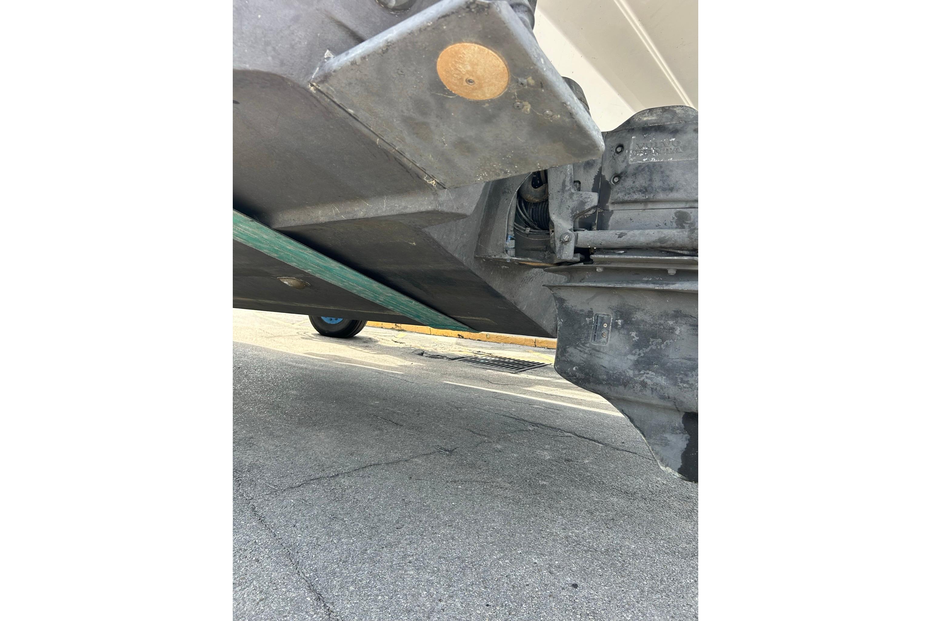 2019 Monterey 335 Sport Yacht underside view, showcasing hull and propeller details.