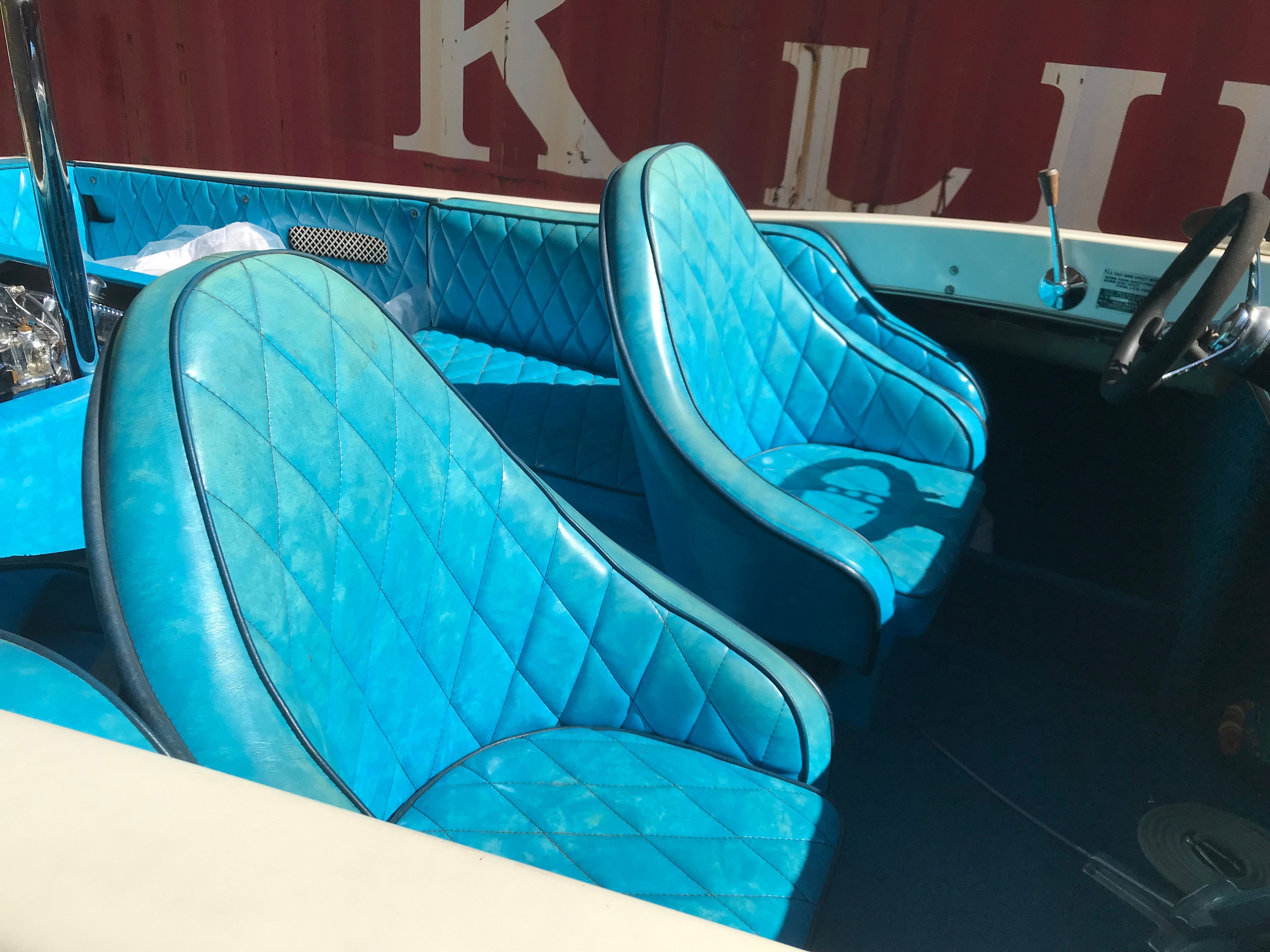 Interior of a 1976 Tahiti Day Cruiser with blue seats.