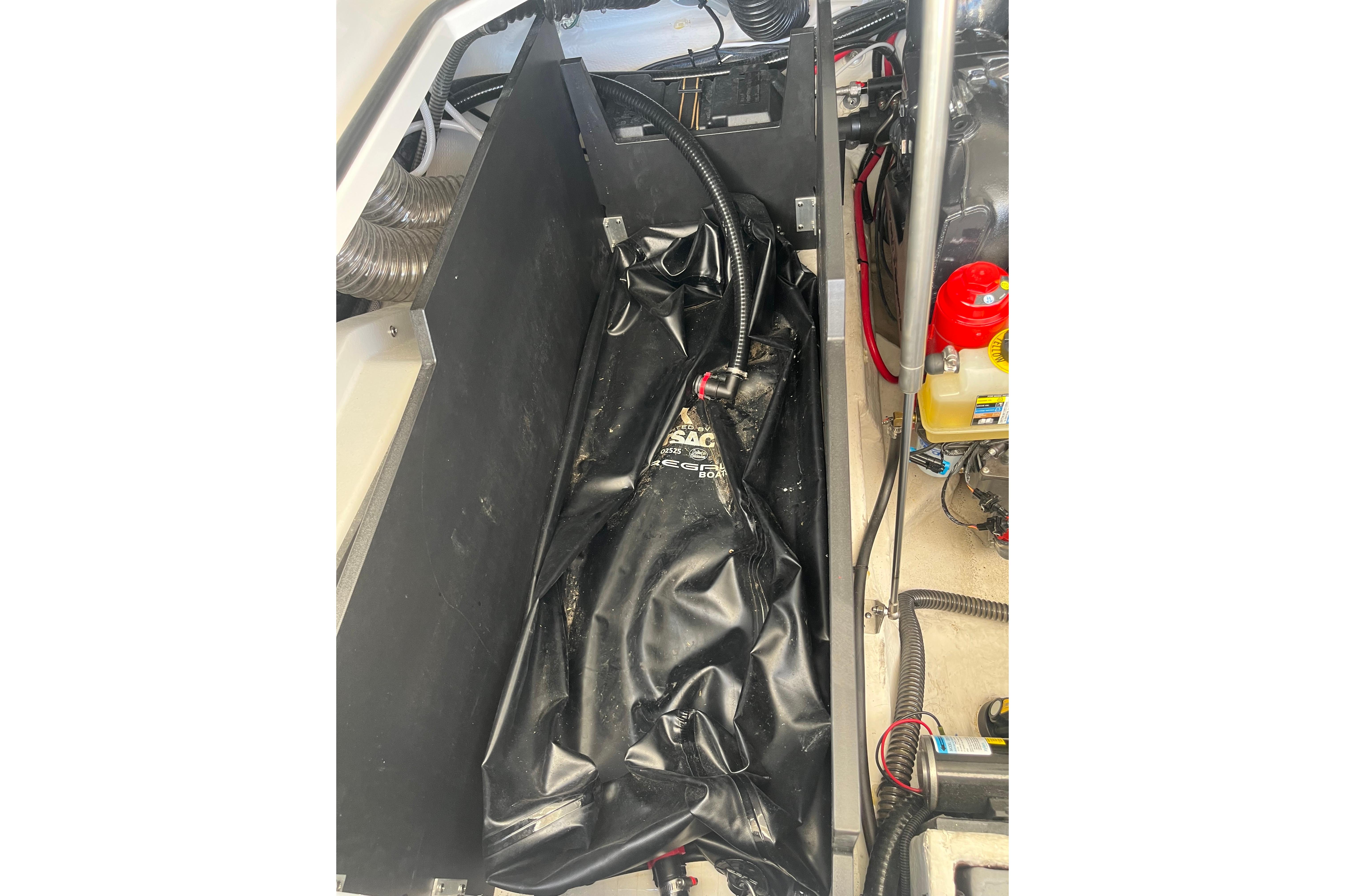 2024 Regal LS9 Surf boat interior showing ballast system and engine components.