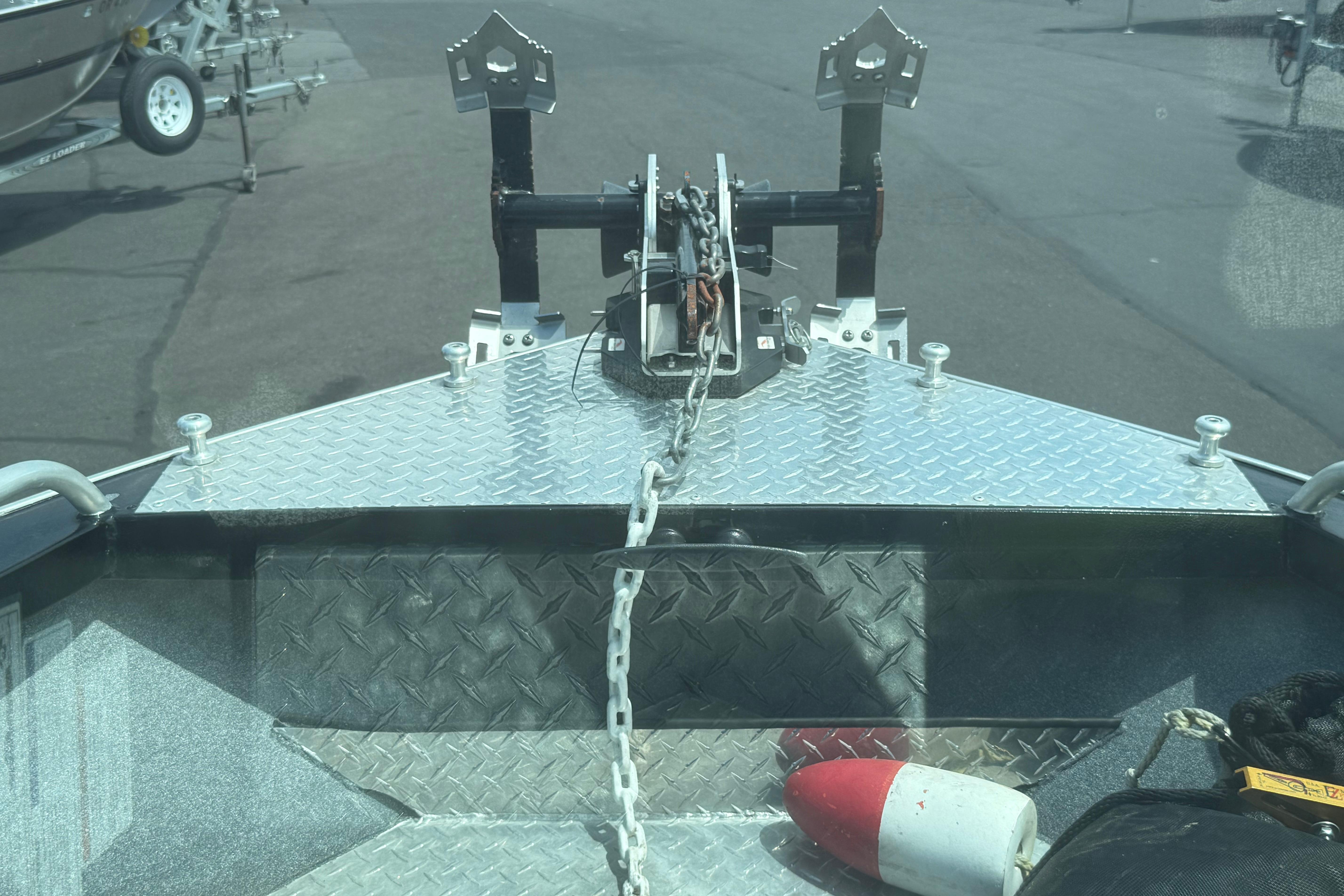 2019 Alumaweld Intruder Hard Top 22' boat with diamond plate deck and anchor chain.