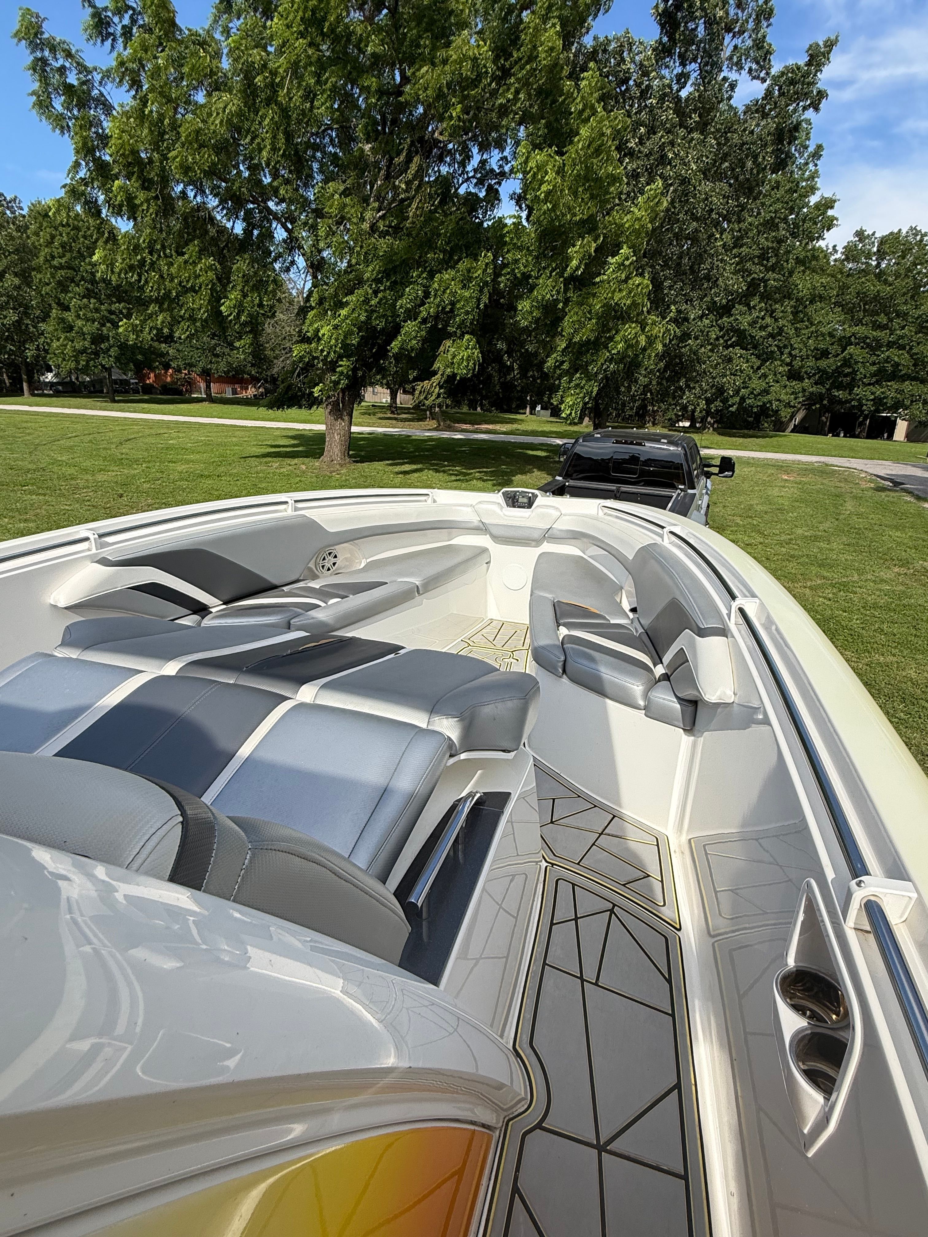 A 2014 Sunsation 34 CCX boat with sleek seating and modern design, on a trailer.