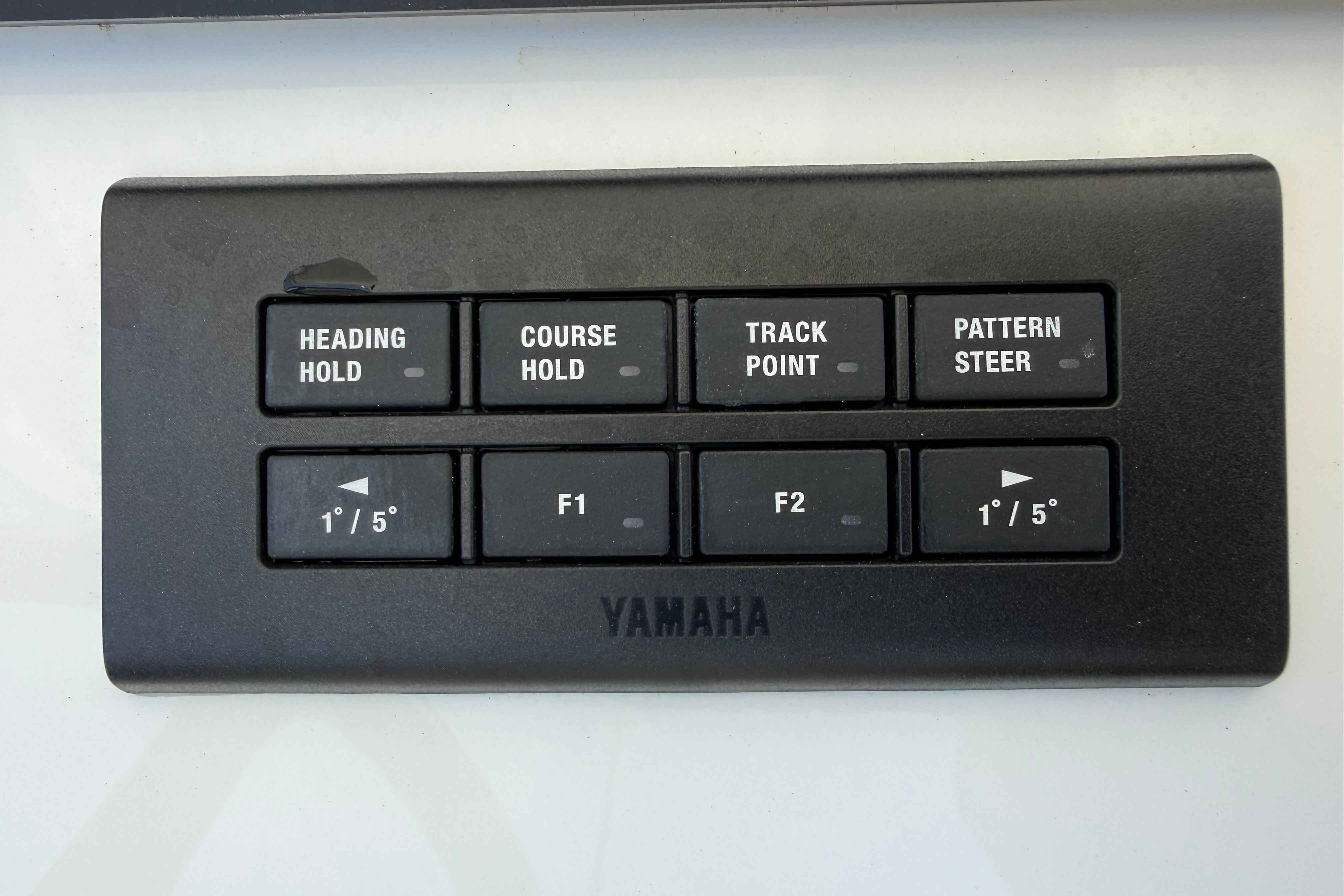 Yamaha control panel with navigation buttons on a 2023 Regulator 26XO boat.