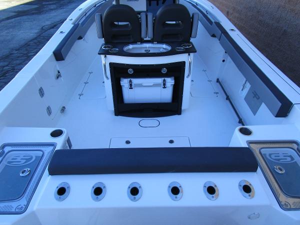 2025 Sea Pro 292 Offshore boat interior with seating and storage compartments.