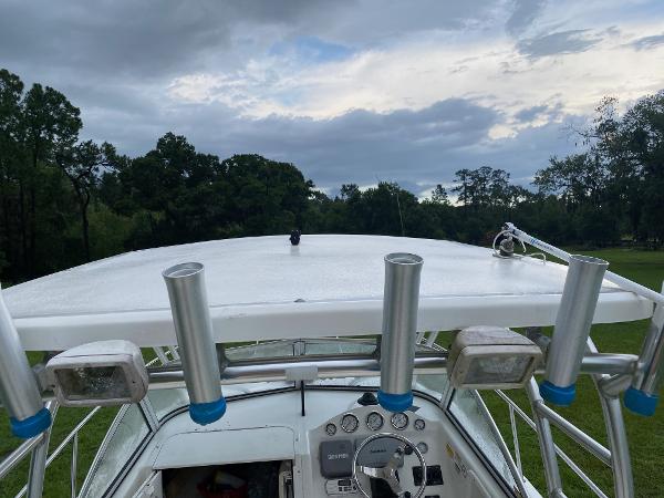 2008 Sea Fox 236WA Pro Series boat with rod holders and control panel.
