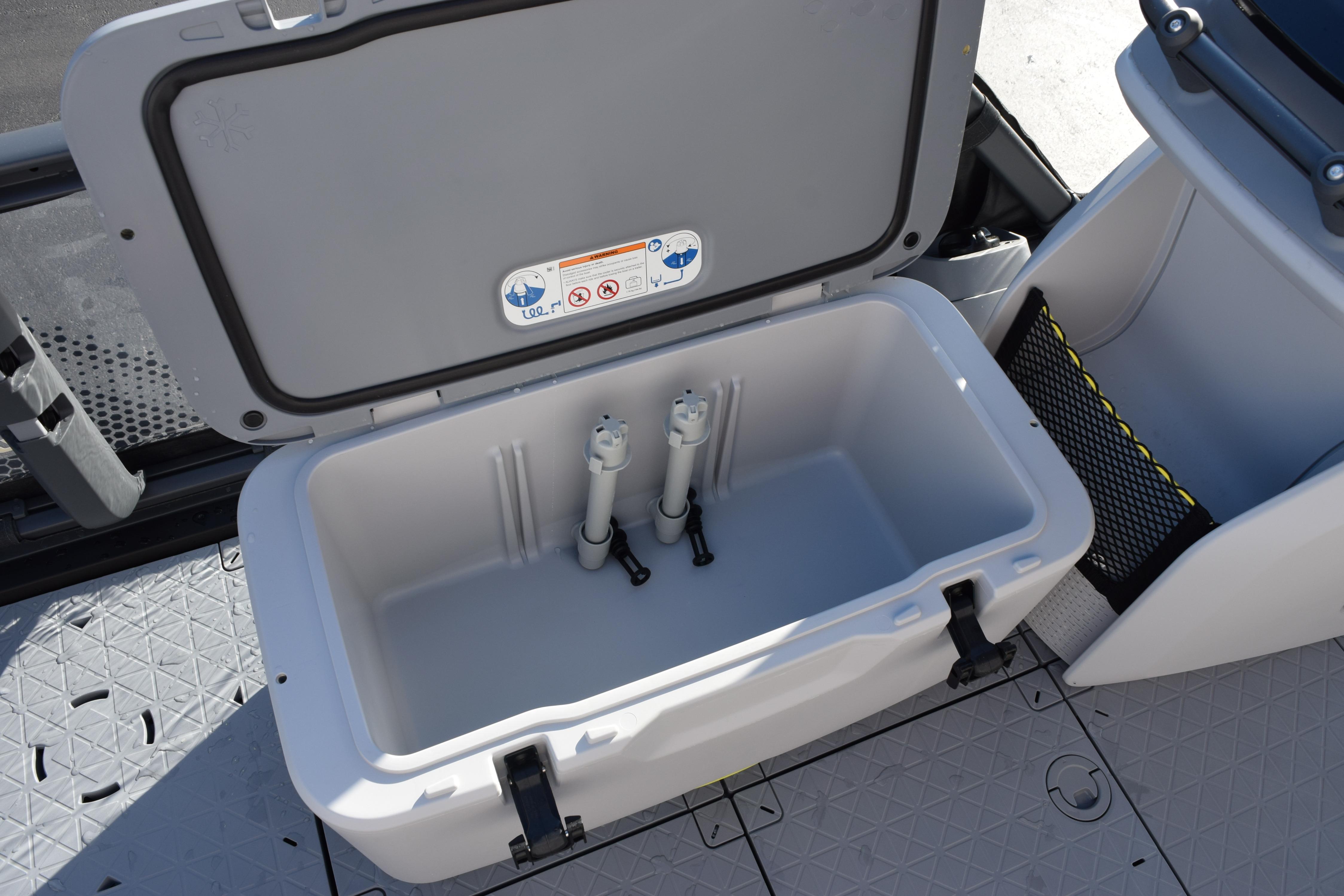 2026 Sea-Doo Switch Fish 21 storage compartment with open lid, showcasing interior space.