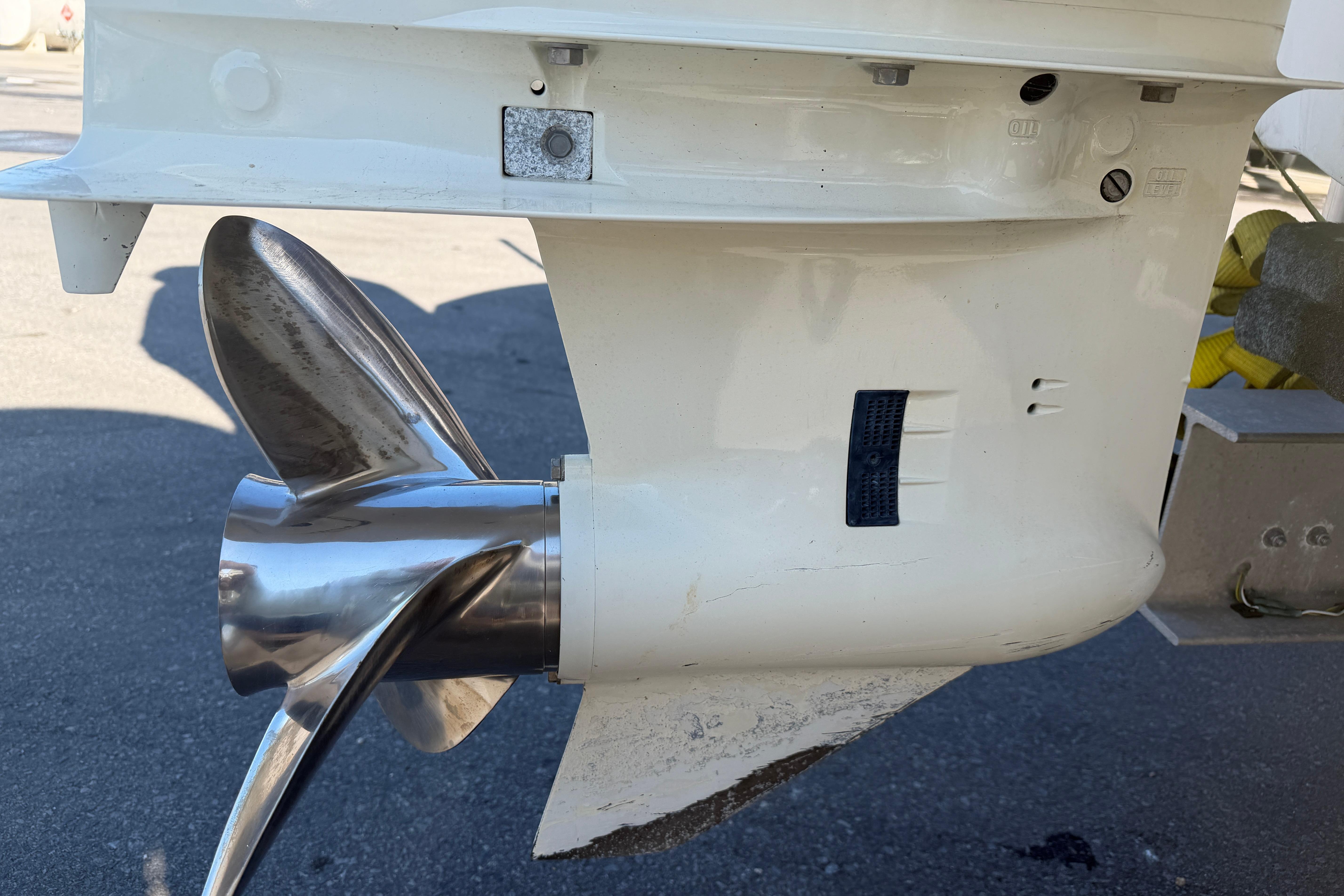 Close-up of a 2018 Twin Vee 260 CC SE boat propeller and lower unit.