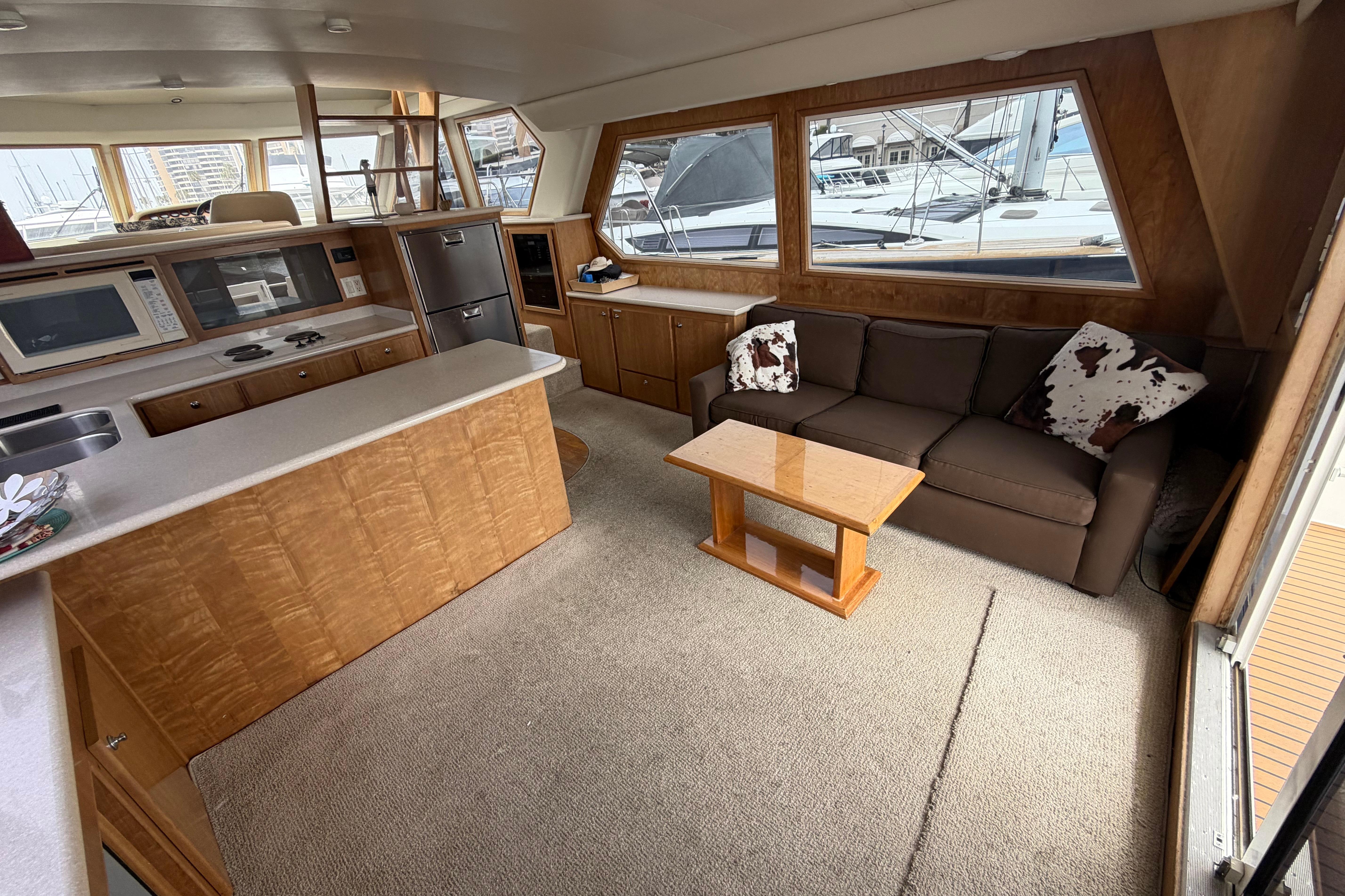 Interior of 2005 Navigator 53 Pilot House yacht with kitchen and seating area.