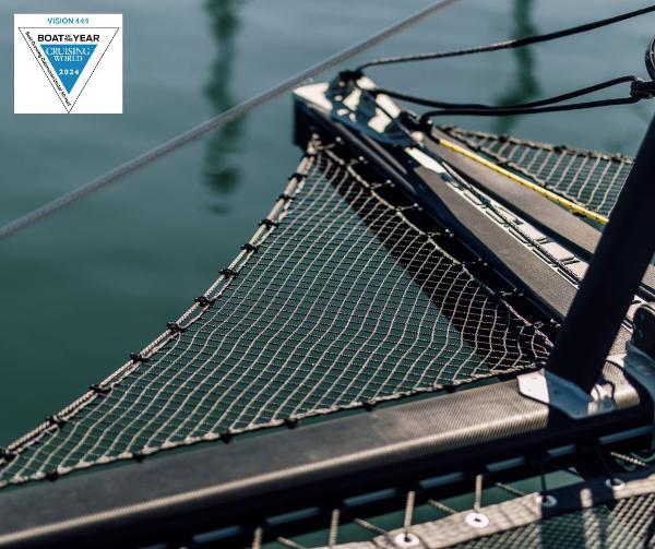 Sailing catamaran Vision 444, 2026 model, featuring netting and sleek design on calm water.