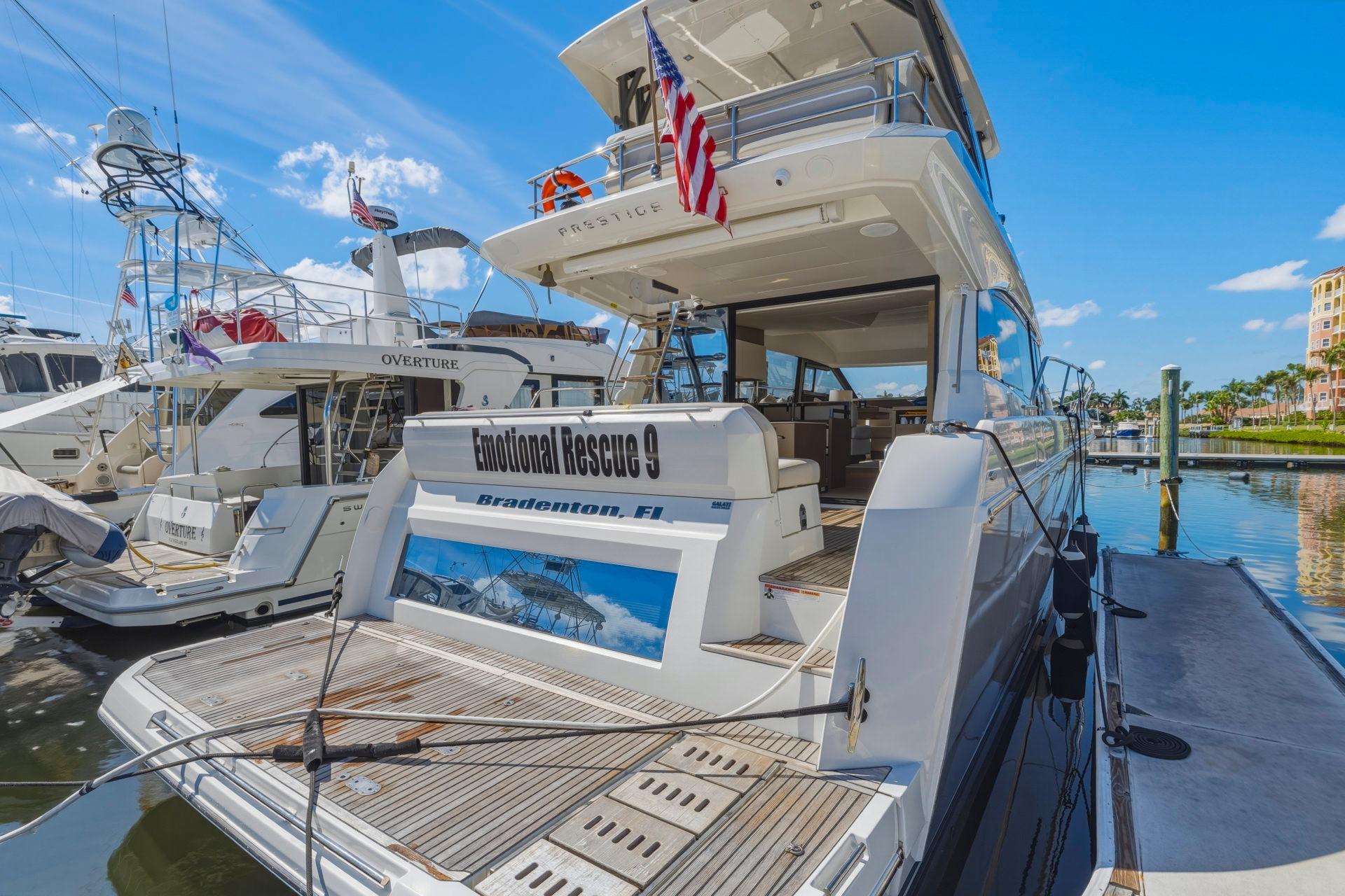 Luxury 2022 Prestige 520 yacht docked at marina, Bradenton, Florida.