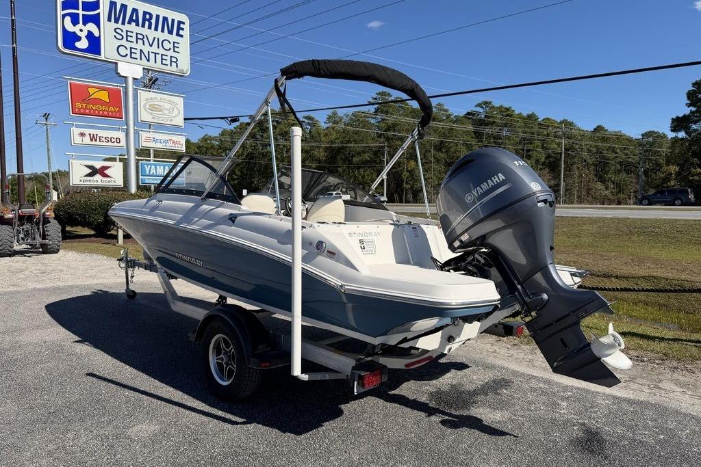 2024 Stingray 191 DC boat with Yamaha engine at marine service center.