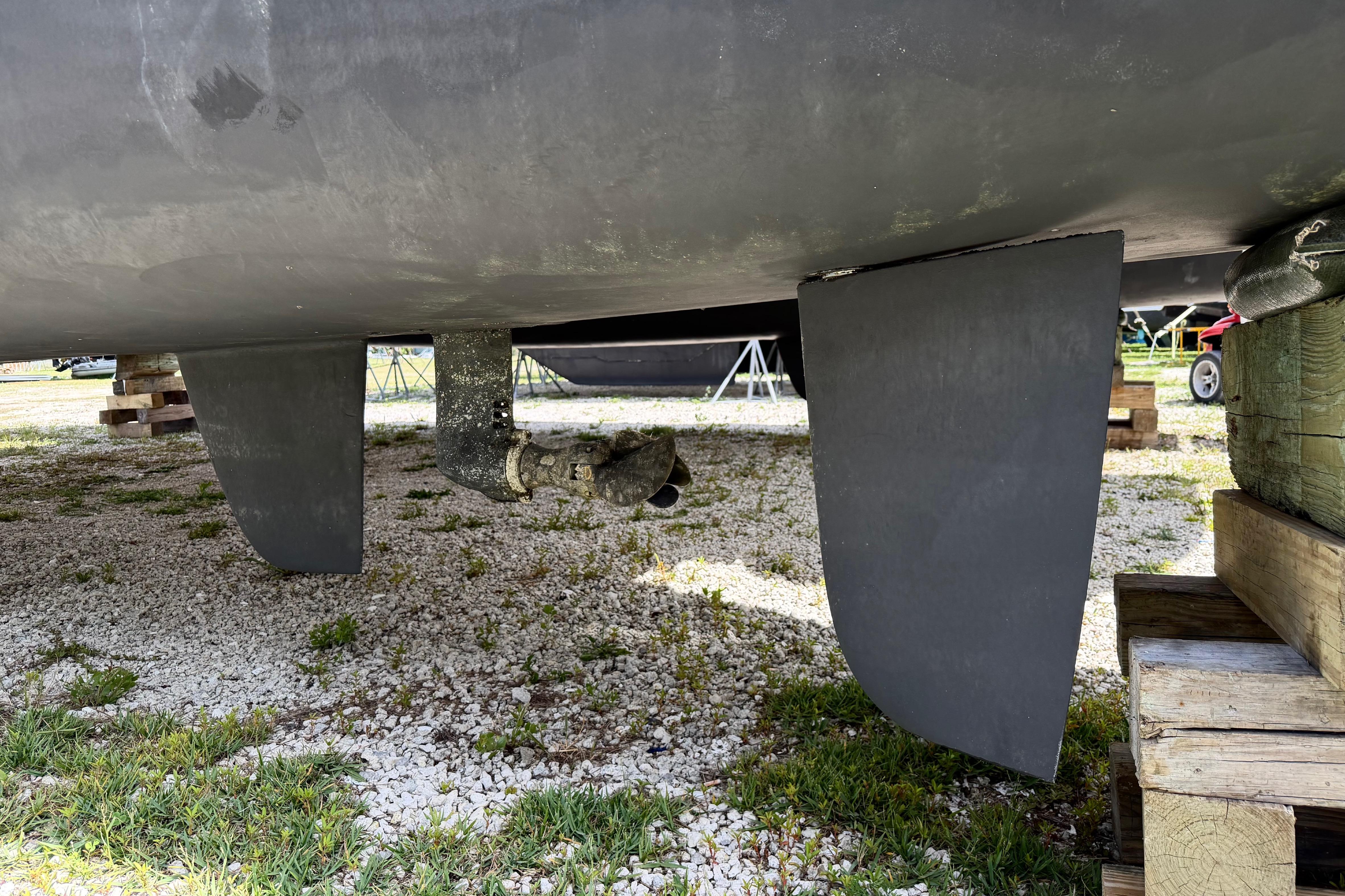 Underneath view of a 2016 Outremer 45 catamaran on dry land.