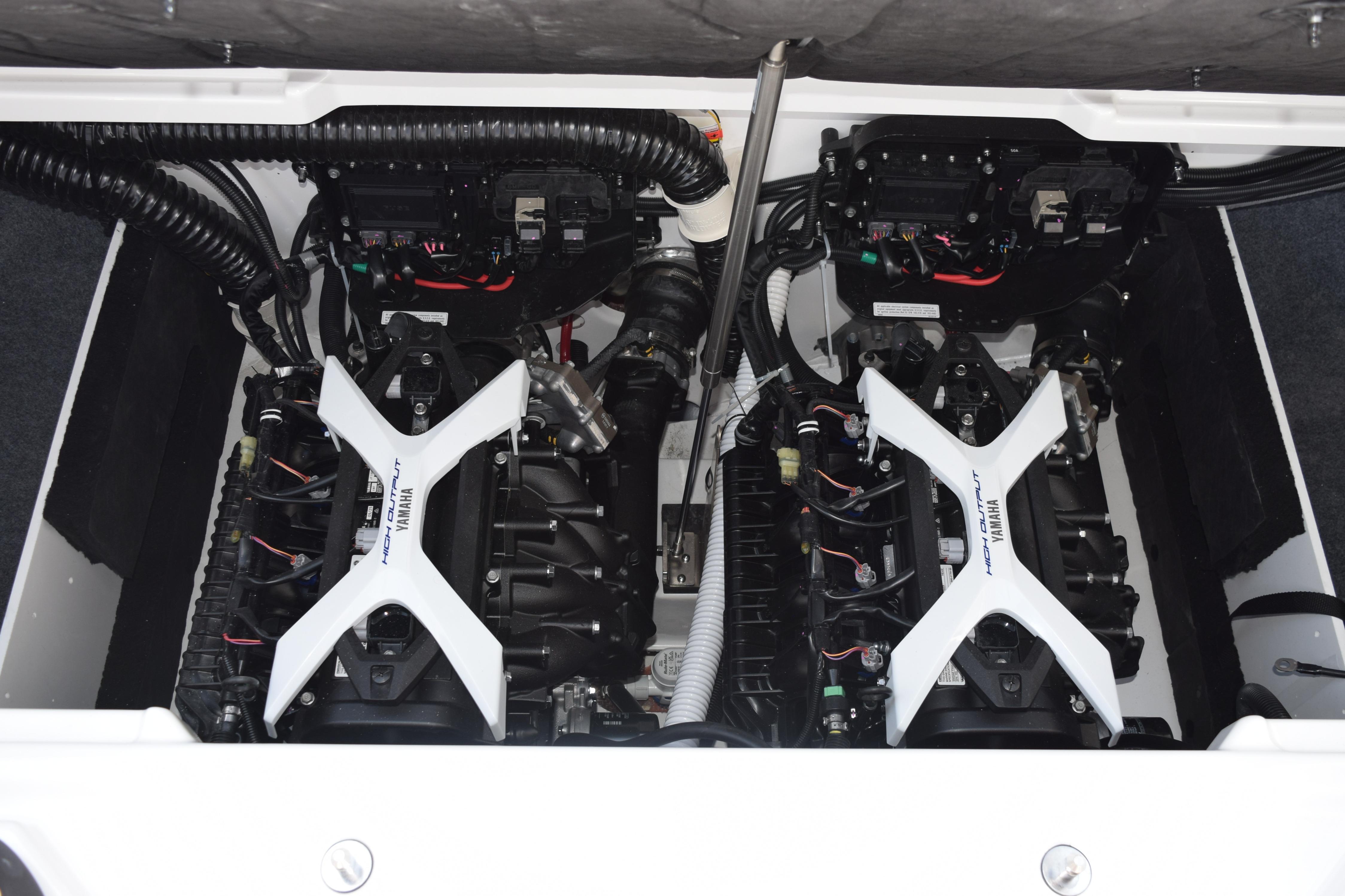 2026 Yamaha Boats 222SE engine compartment with twin engines and detailed components.
