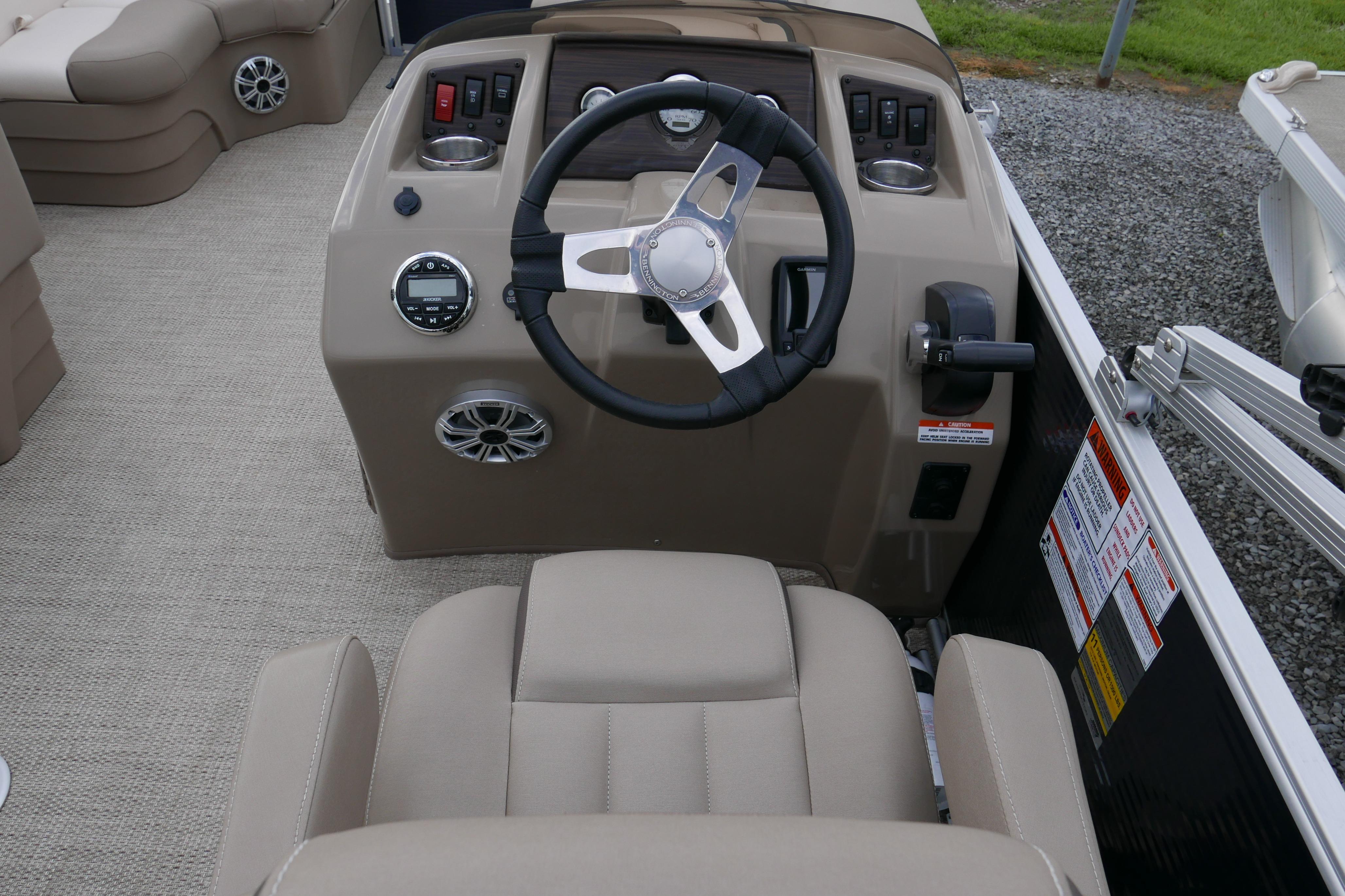 2019 Bennington SX 20 SLXP boat helm with steering wheel and control panel.