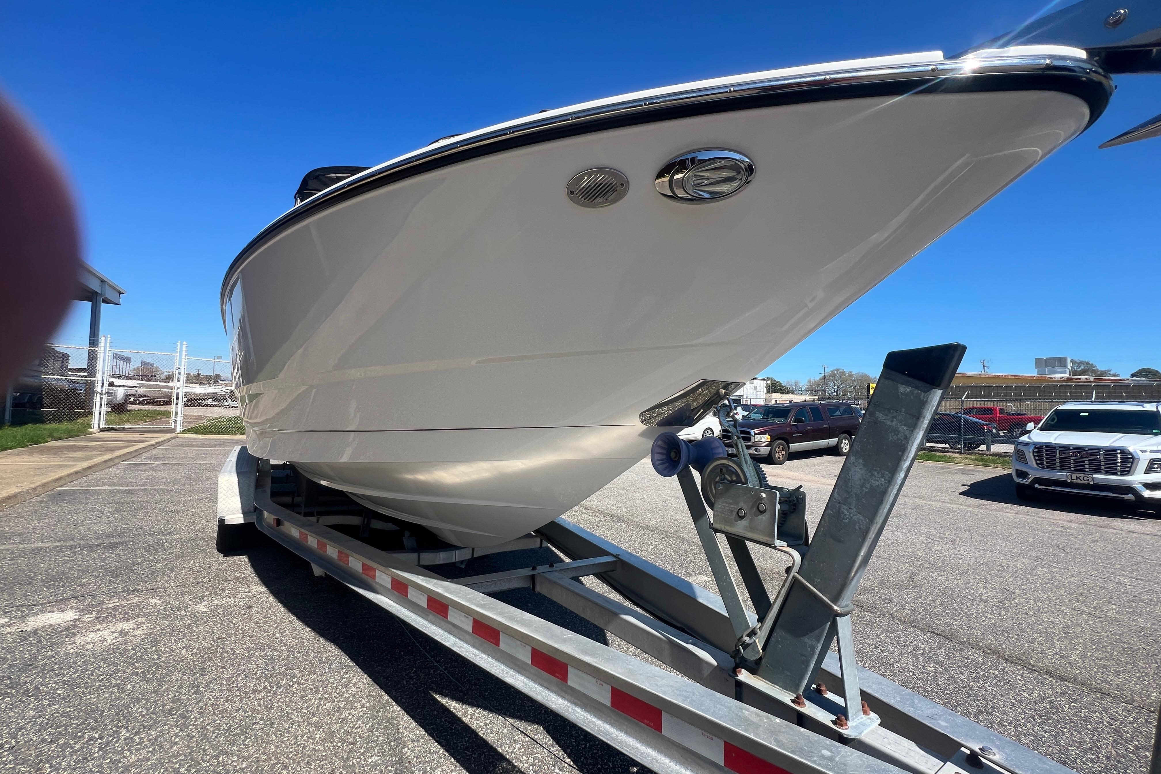 2017 Monterey 298SS Super Sport boat on trailer in parking lot.