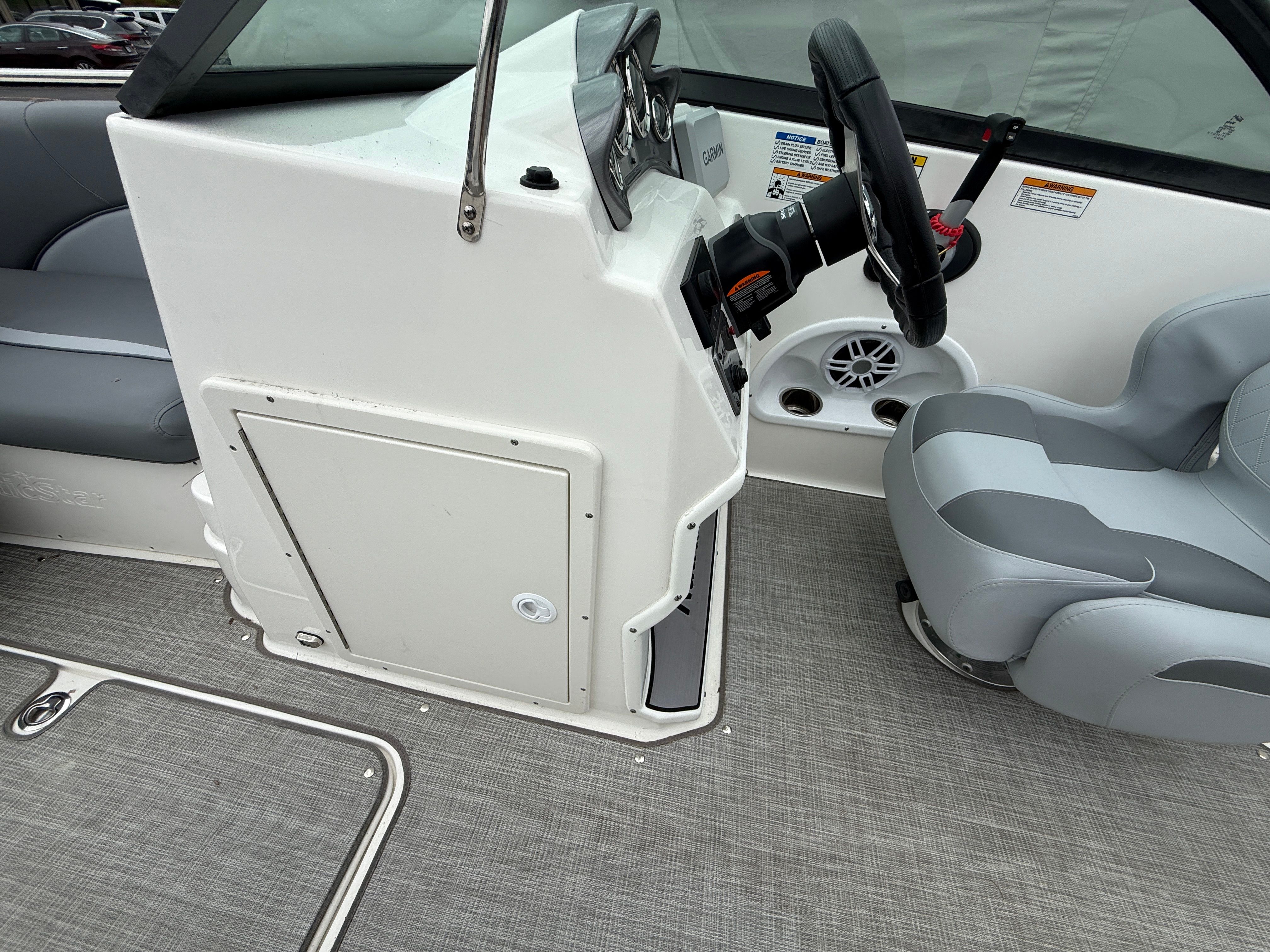 Interior of a 2023 NauticStar 203 DC boat with steering console.