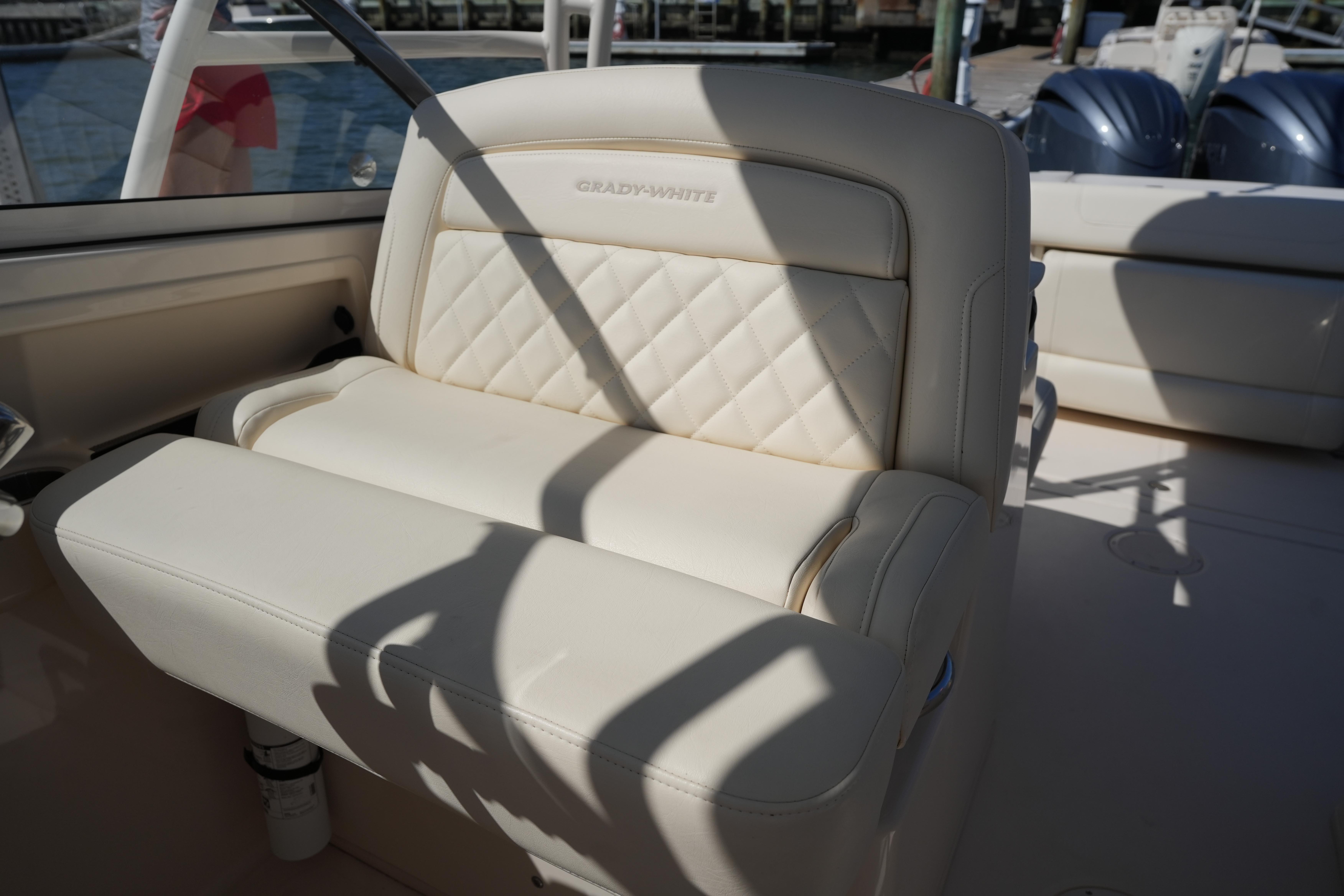 Luxurious seating on 2022 Grady-White Freedom 285 boat, featuring elegant diamond stitching.