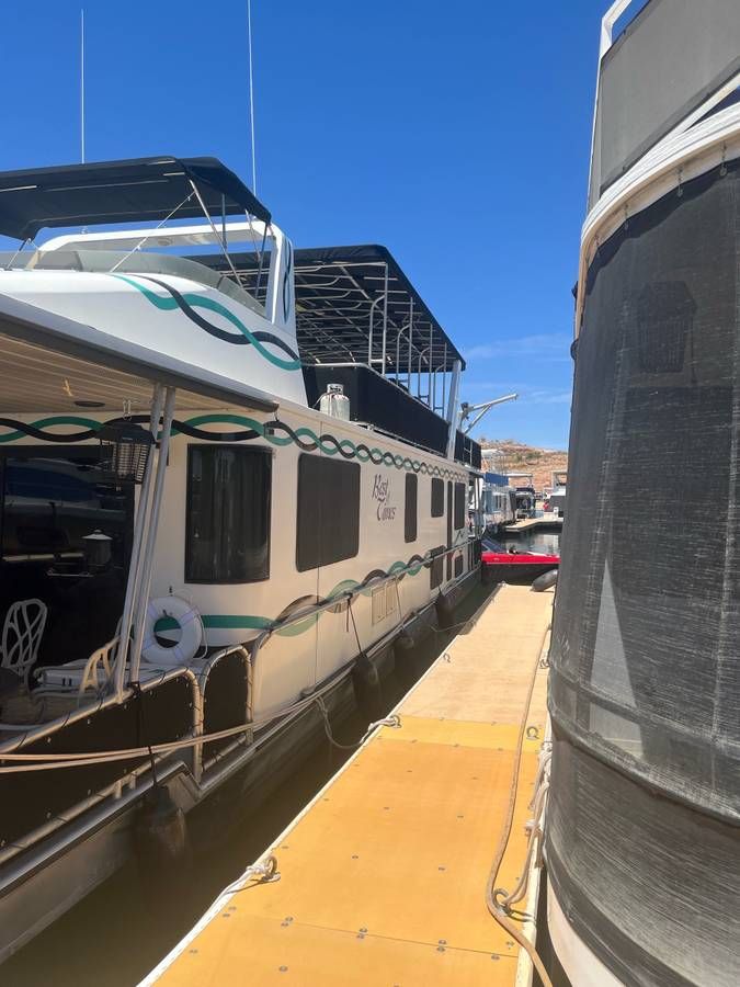 1993 Lakeview houseboat docked on a sunny day.