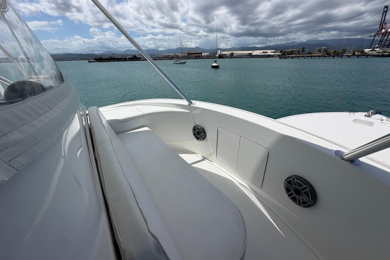 2012 Viking 50 Convertible yacht deck with ocean view and cloudy sky.