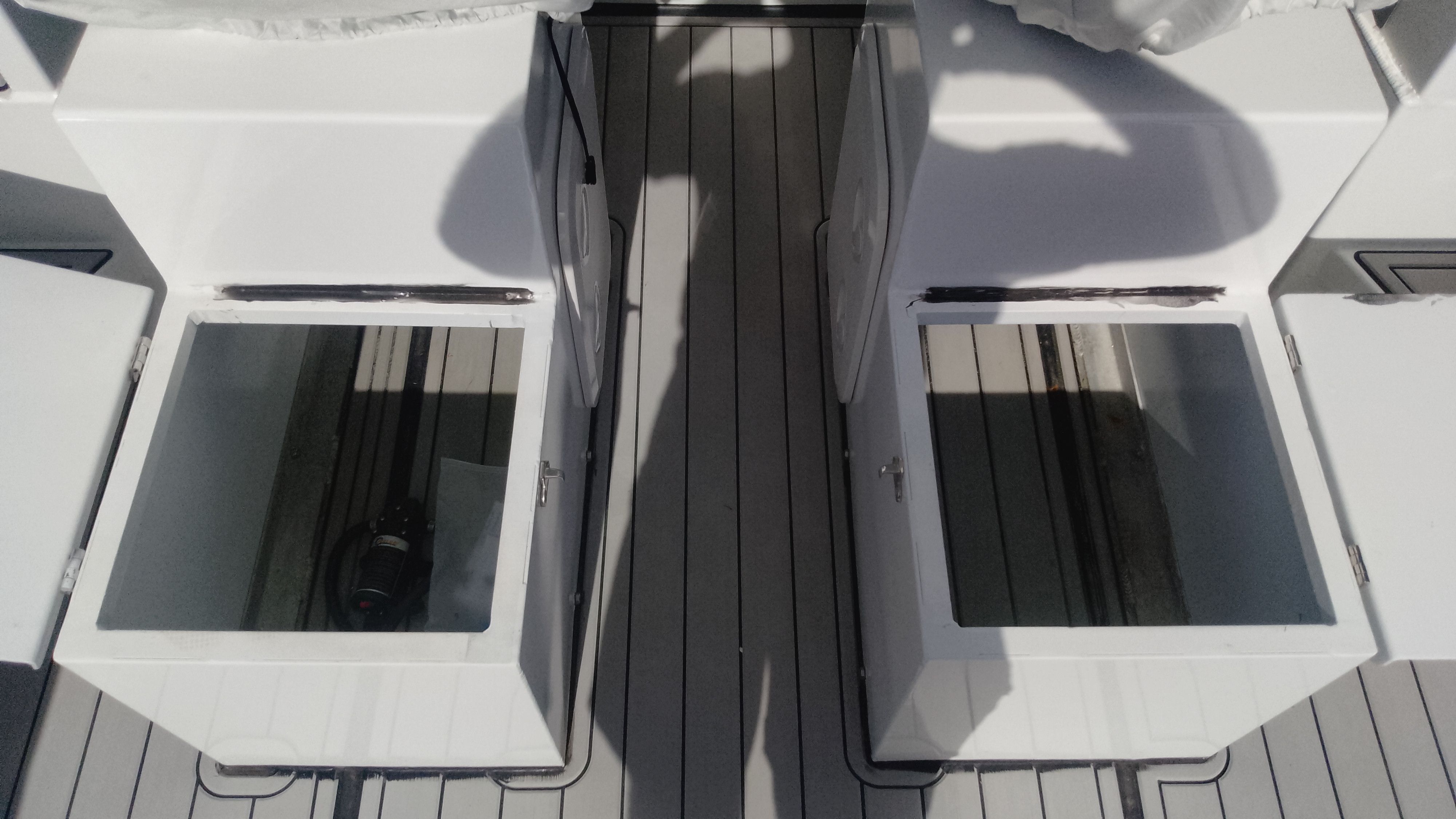 Gospel Boat 7.5M 2024 with open storage compartments on deck.