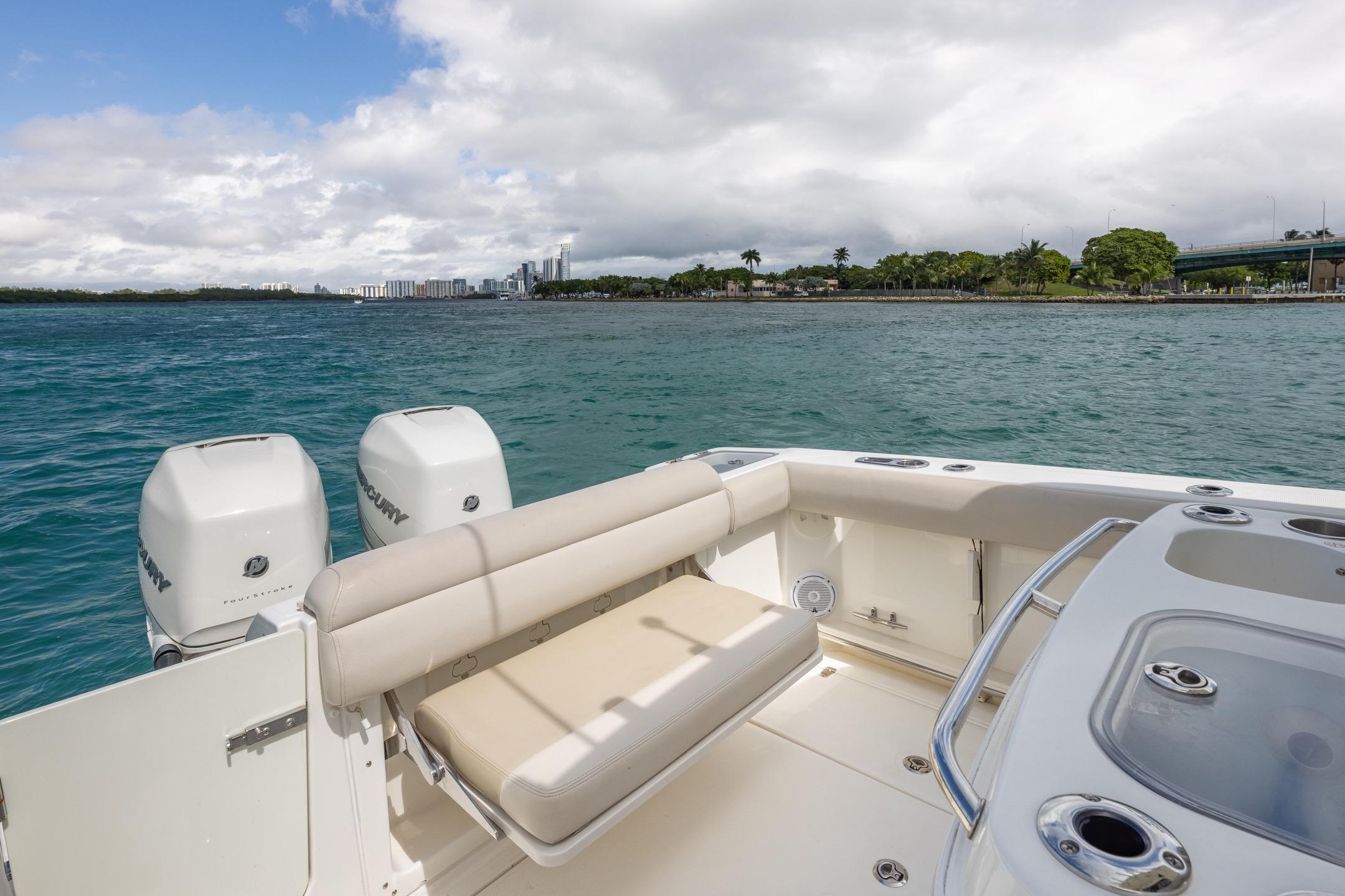 2016 Boston Whaler 280 Outrage boat with dual Mercury engines on scenic water.