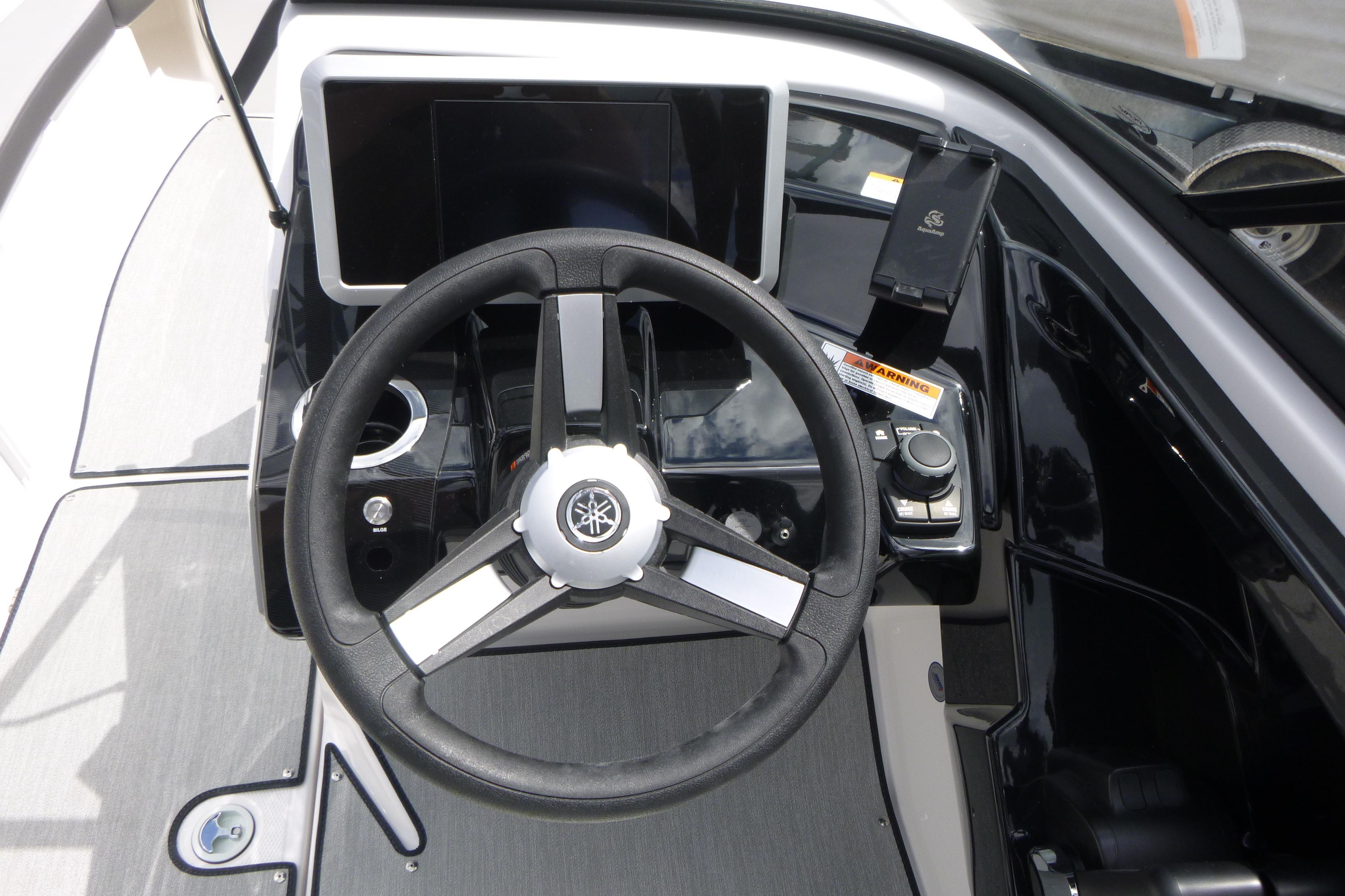 2026 Yamaha Boats AR250 steering console with modern controls and display.