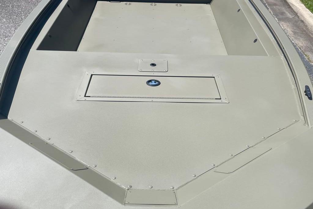2026 Tracker Grizzly 1648 Utility boat deck, featuring a storage compartment.
