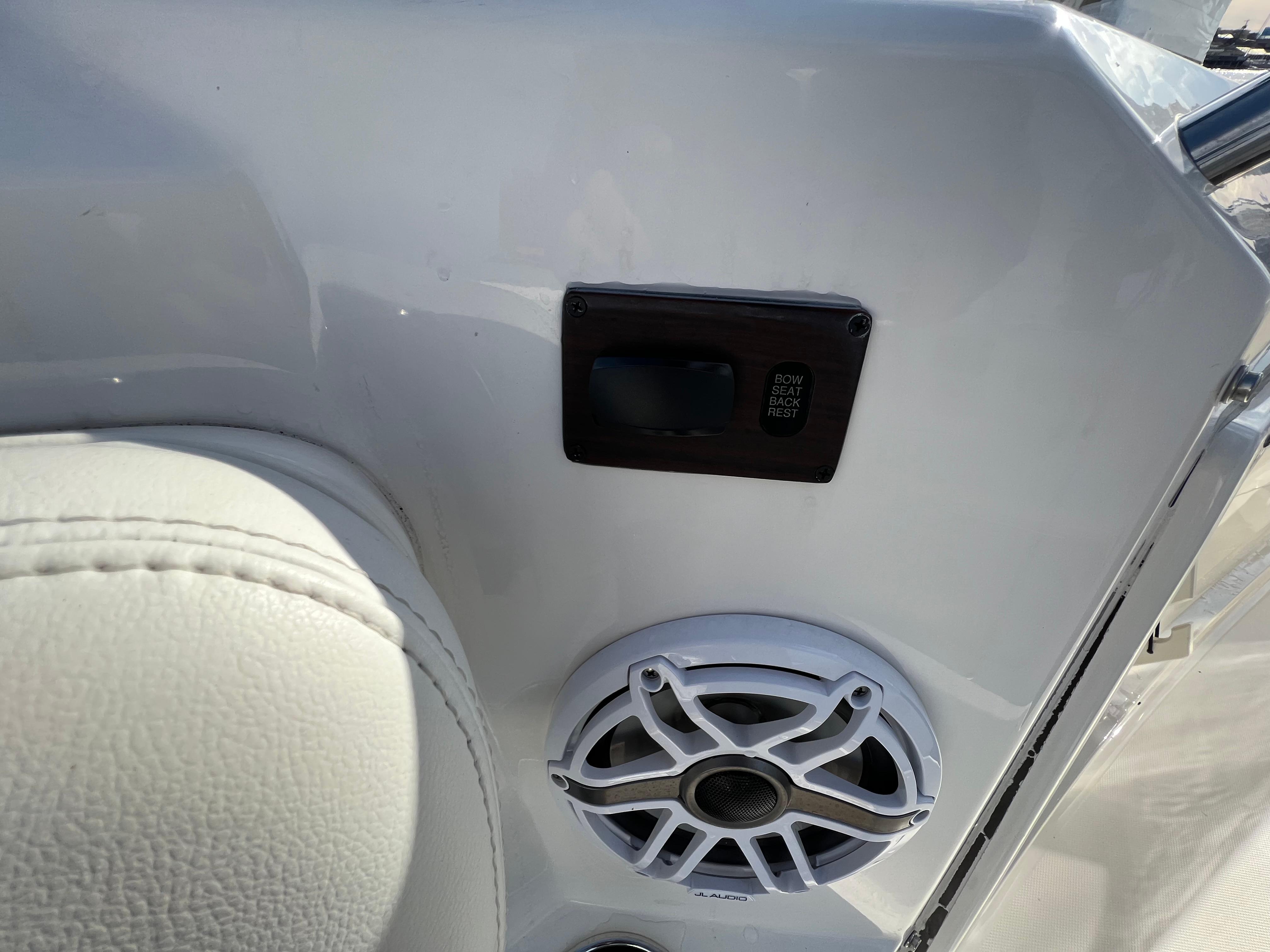 Interior of 2022 Pursuit S 358 boat with speaker and control panel.