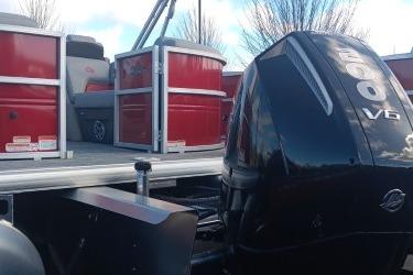 2026 Sun Tracker Party Barge 22 XP3 with powerful V6 engine, red and silver design.