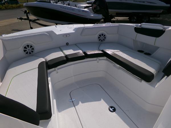 2024 Tahoe 2150 CC boat interior with cushioned seating and speakers.