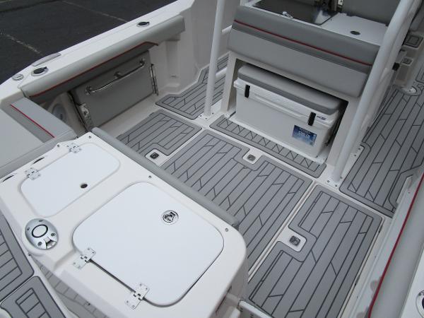 2025 Solara S-250 CW boat interior with gray deck and storage compartments.