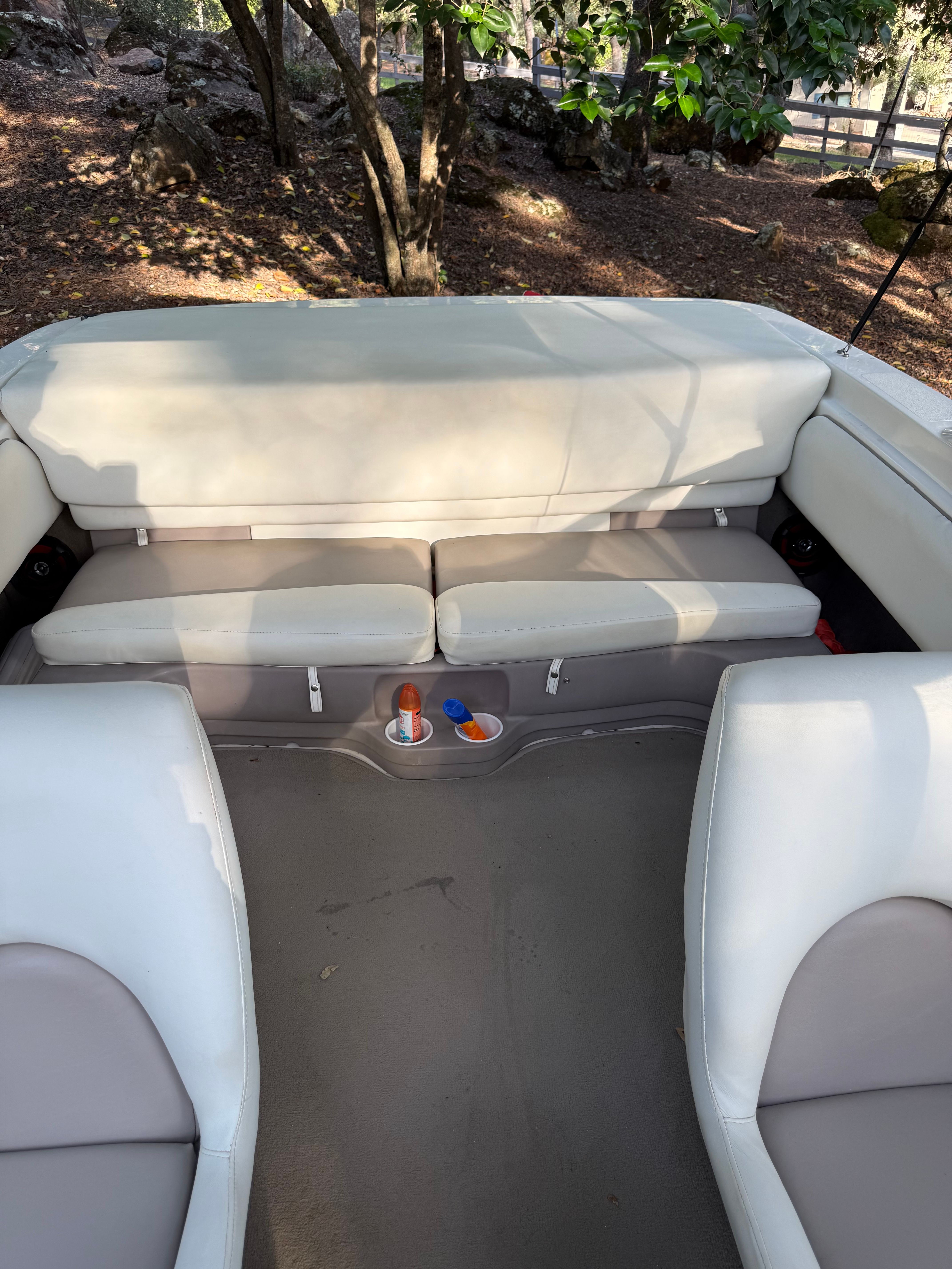 Interior of a 2003 Glastron SX 195 boat with beige seating.