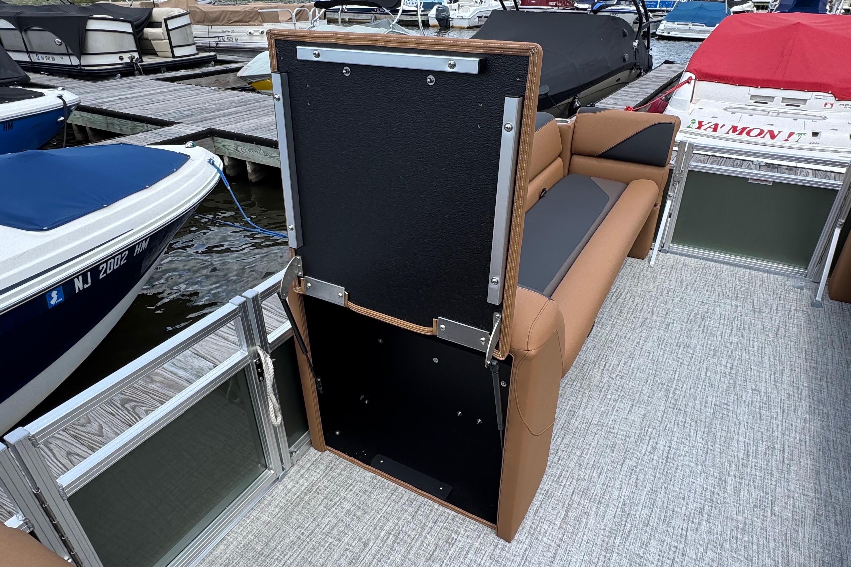 2026 Tahoe Pontoon Sport 85 Cruise Rear Bench 23 at marina, showcasing seating and storage.