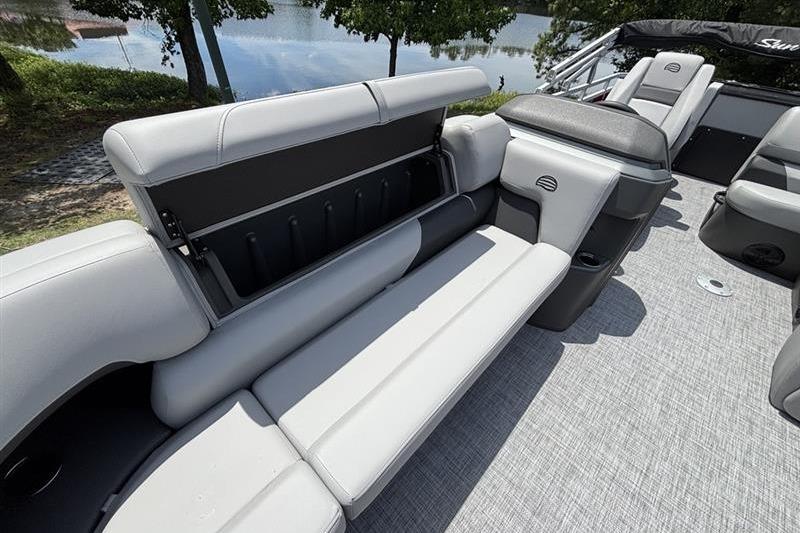 2026 Sun Tracker SportFish 20 DLX boat interior with gray seating and storage compartment.