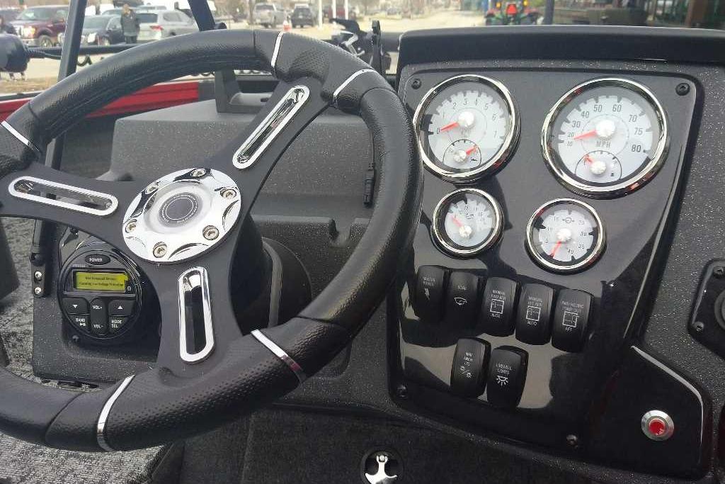 Dashboard of 2026 Tracker Targa V-18 WT boat with steering wheel and gauges.