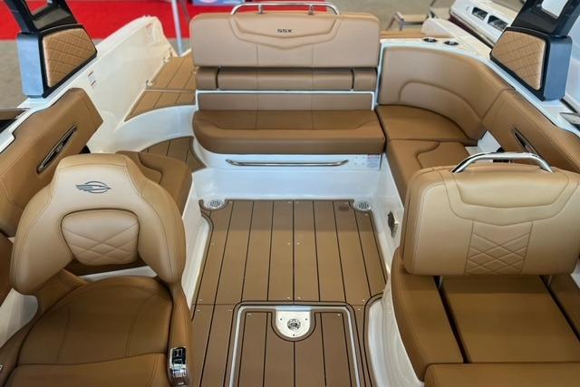 Luxurious interior of 2025 Chaparral 247 SSX boat with tan leather seating.