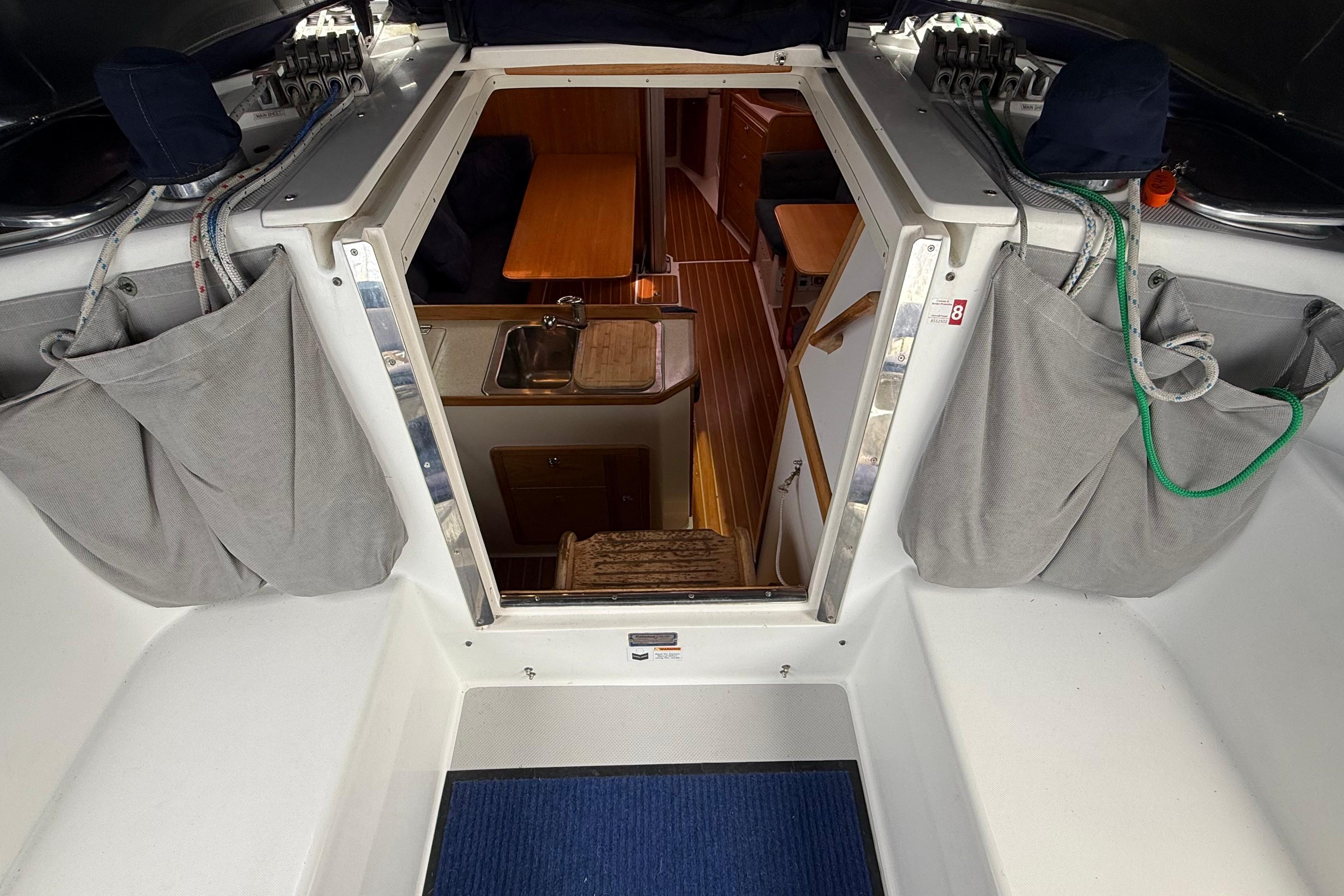 Interior view of a 2005 Catalina 36 MkII sailboat, showing cabin entrance and galley.