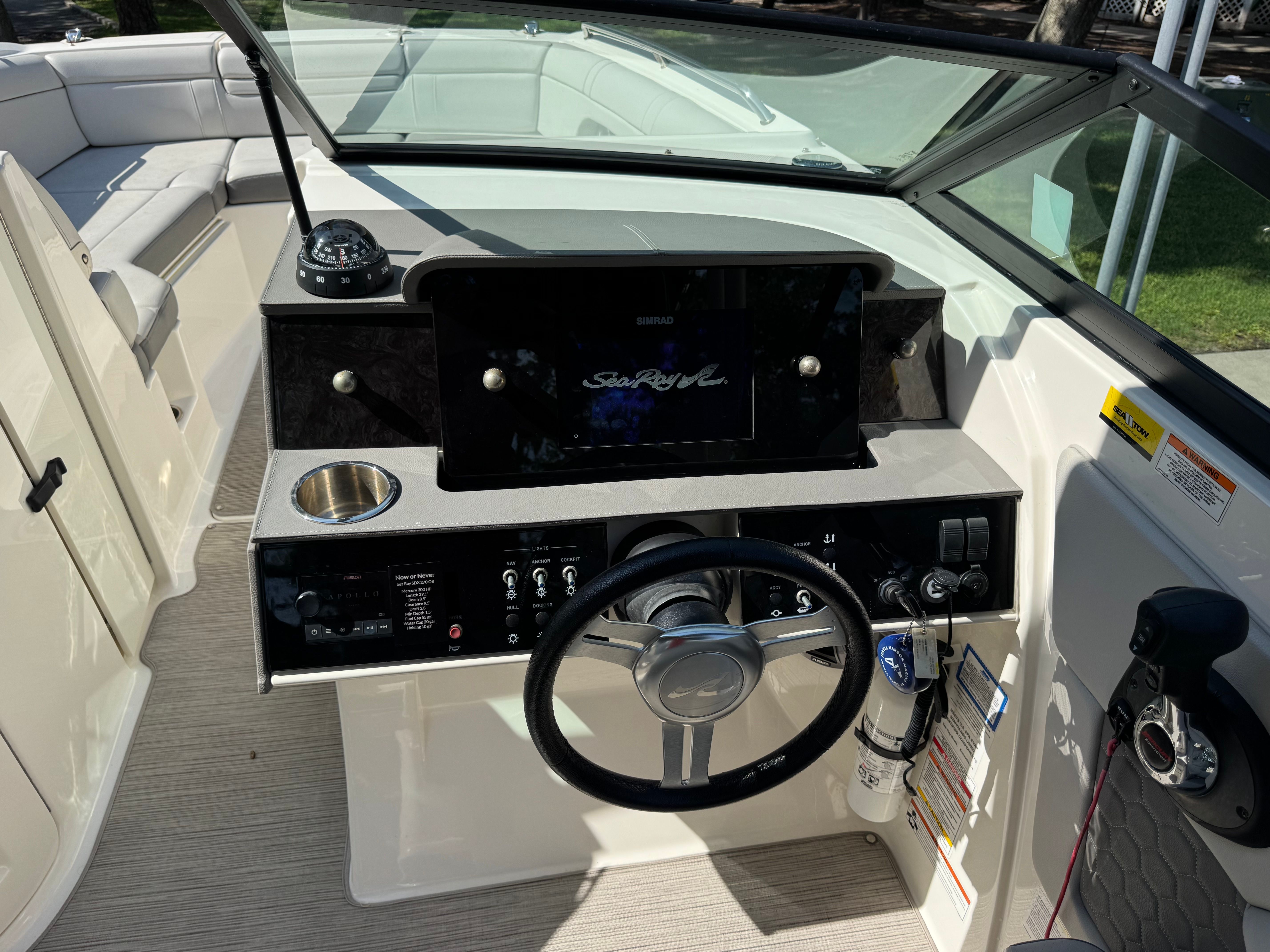 2020 Sea Ray SDX 270 Outboard cockpit with controls and display.