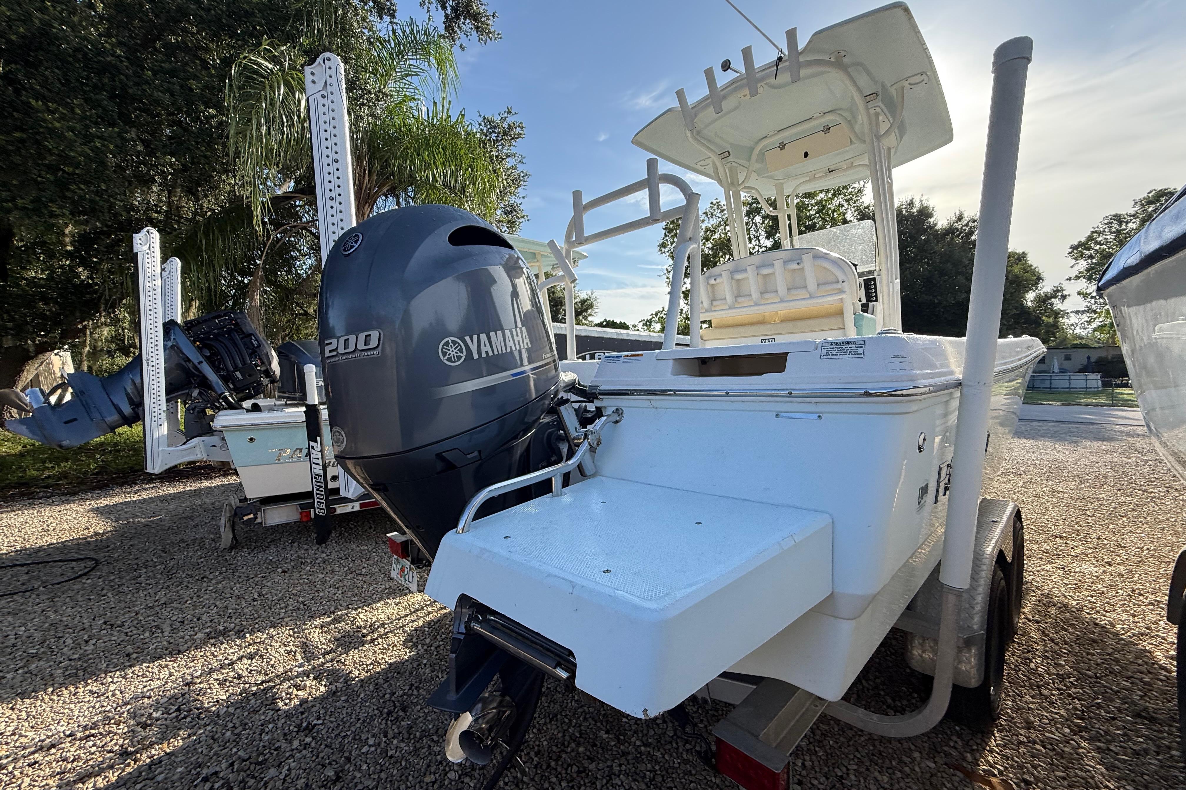 2017 Robalo 226 Cayman boat with Yamaha 200 engine, parked outdoors.