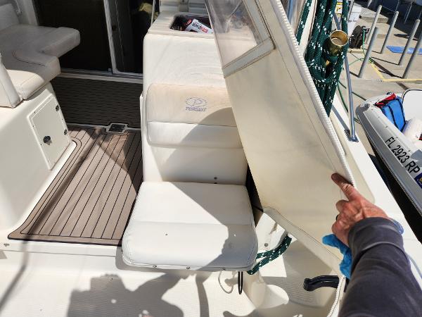 2005 Pursuit 3070 Offshore Center Console boat interior with seating and deck details.