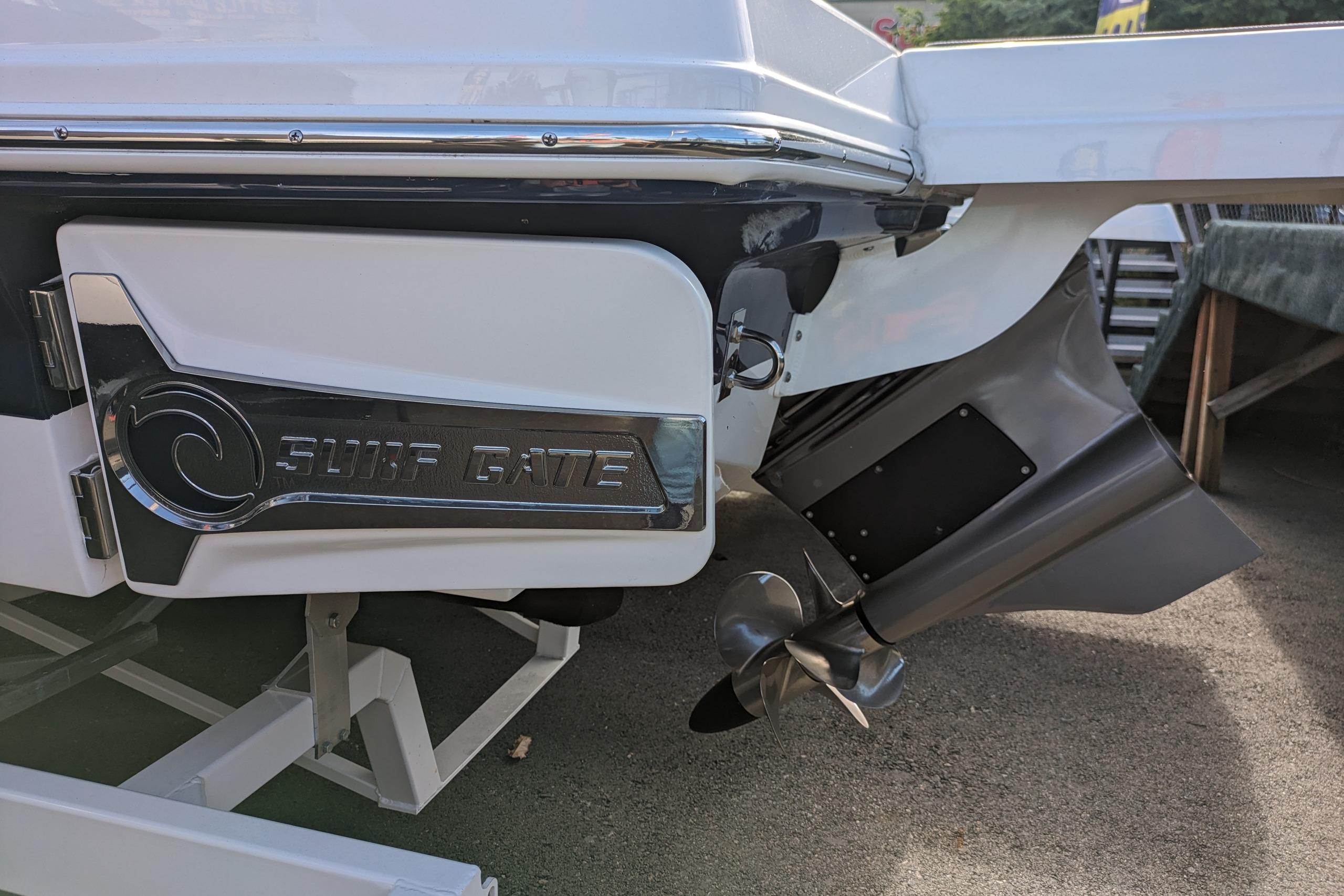 2023 Chaparral 23 Surf boat with Surf Gate feature and propeller detail.