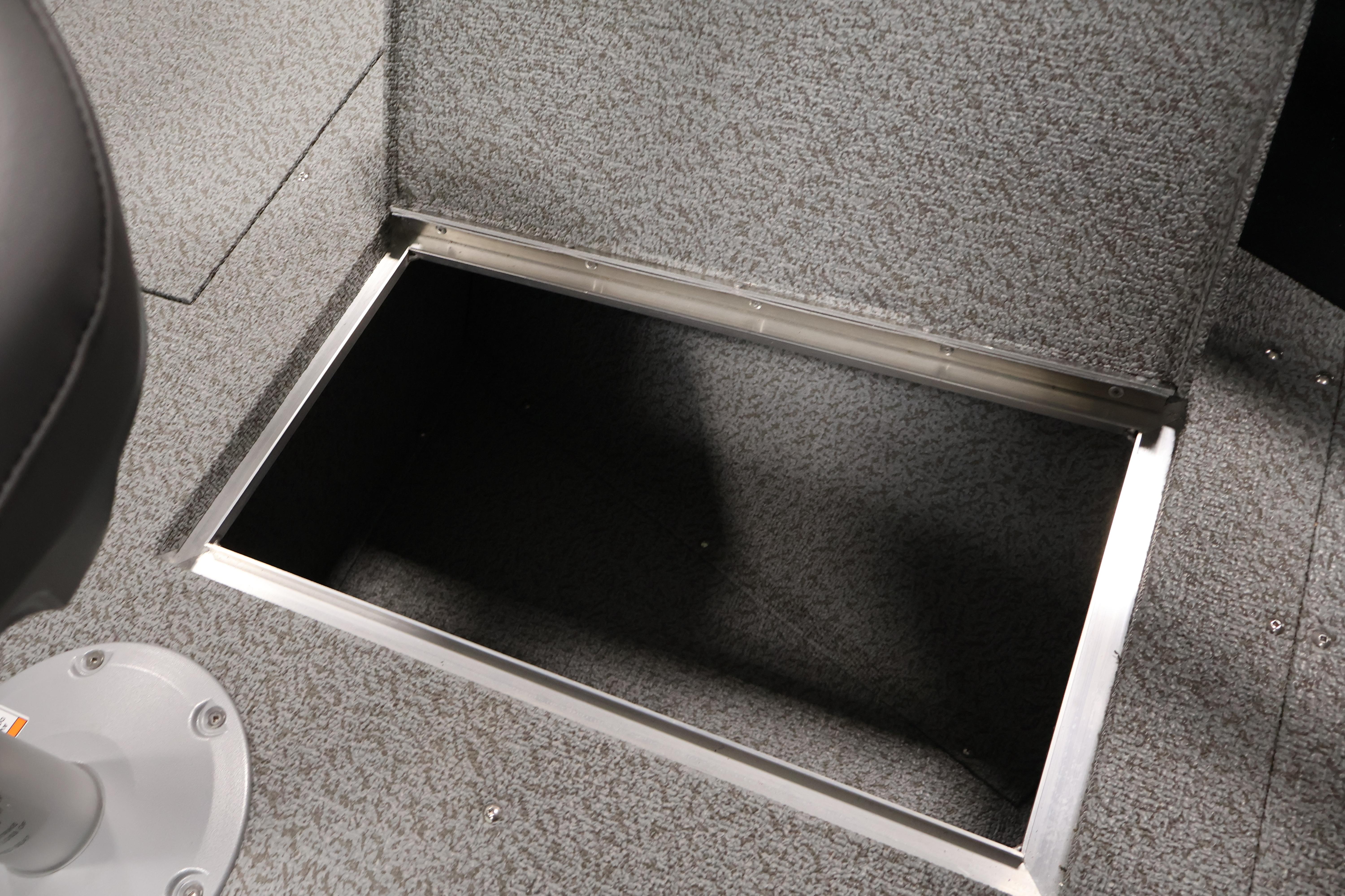 Open storage compartment in 2026 Crestliner 1850 Kodiak SC boat interior.