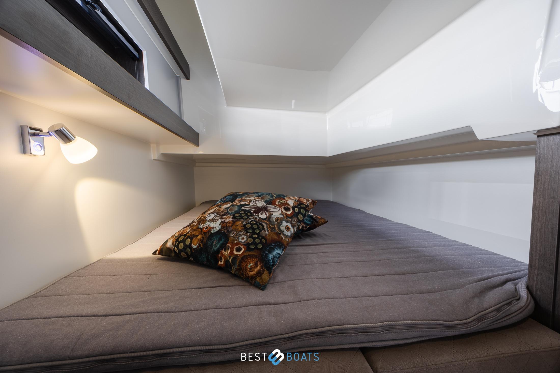 Cozy cabin interior of 2023 Cobra Yachts Futura 36 Premium Fly with modern lighting.