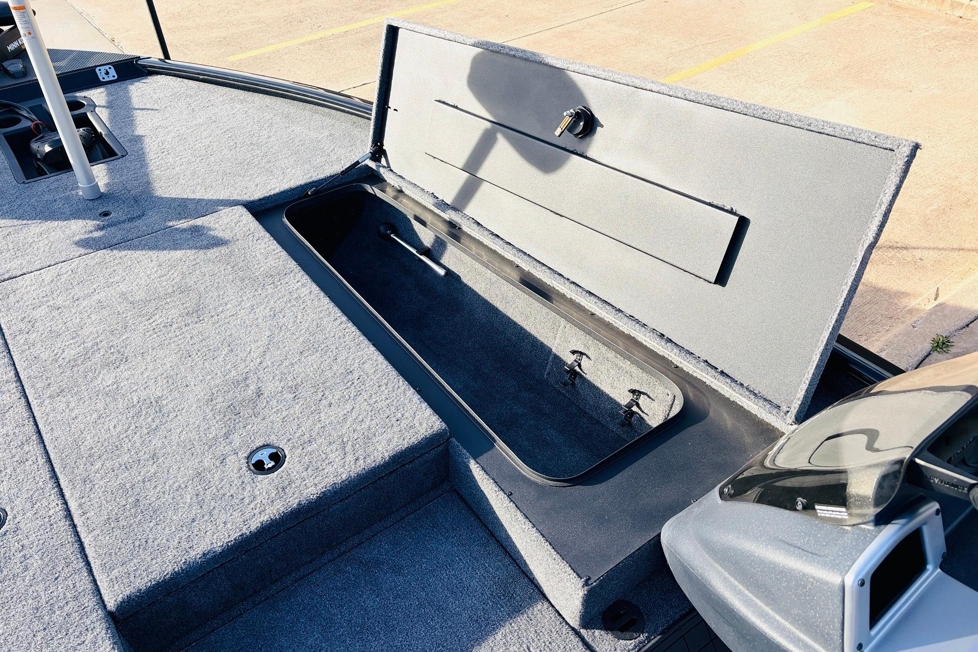 Open storage compartment on 2025 Tracker Savage 215 boat deck.