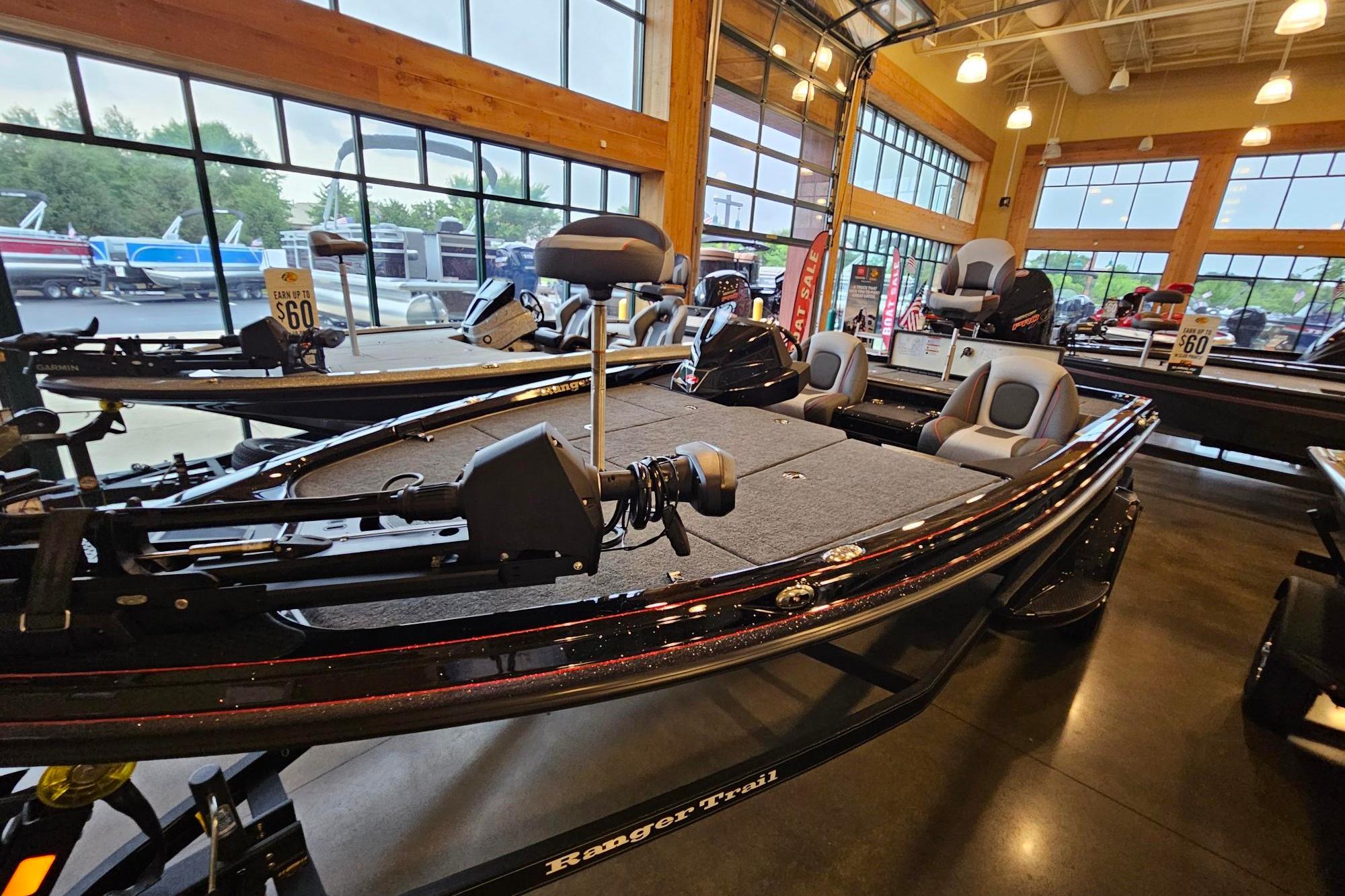 2026 Ranger Z518 Cup-Equipped boat displayed in a showroom with large windows.