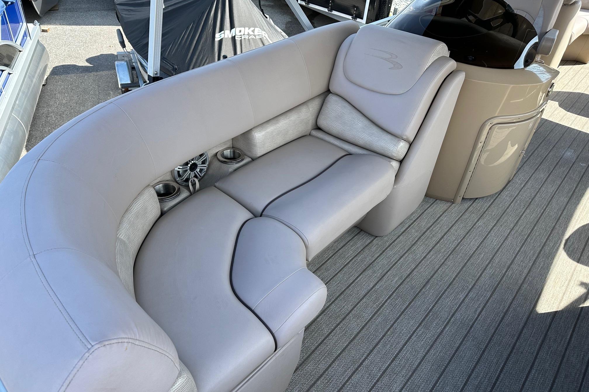 Luxurious seating on 2017 Bennington 22 GPD pontoon boat with cup holders and speaker.
